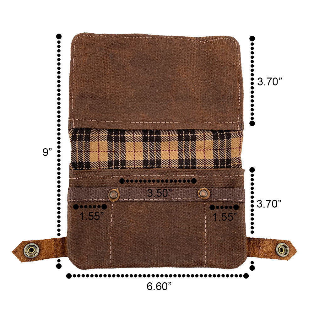 Detailed view of the dark brown Hide & Drink Tobacco Pouch Waxed Canvas showing its compartments for lighters and rolling paper. A classic storage solution, this travel essential emphasizes small batch production and handmade artistry.