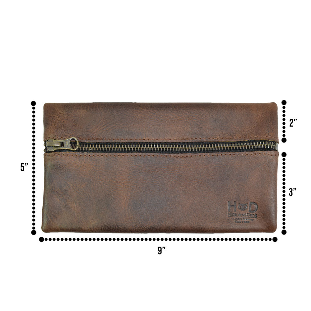 Hide & Drink Utility Cord Pouch with dimensions displayed, emphasizing its practicality and stylish design. Ideal as a mobile all-purpose utility & charger case for MacBook, iPad & Laptop, it's also a perfect cable organizer for travel, handmade from full grain leather in La Antigua Guatemala & Oaxaca Mexico.