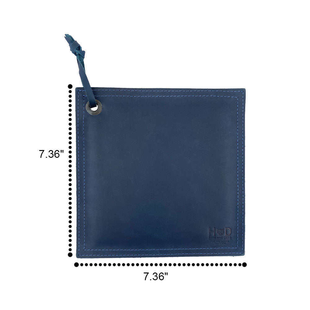 Hide & Drink Pot Pad in vibrant black leather, highlighting its rustic charm. This double-layered potholder is handcrafted to provide heat protection.