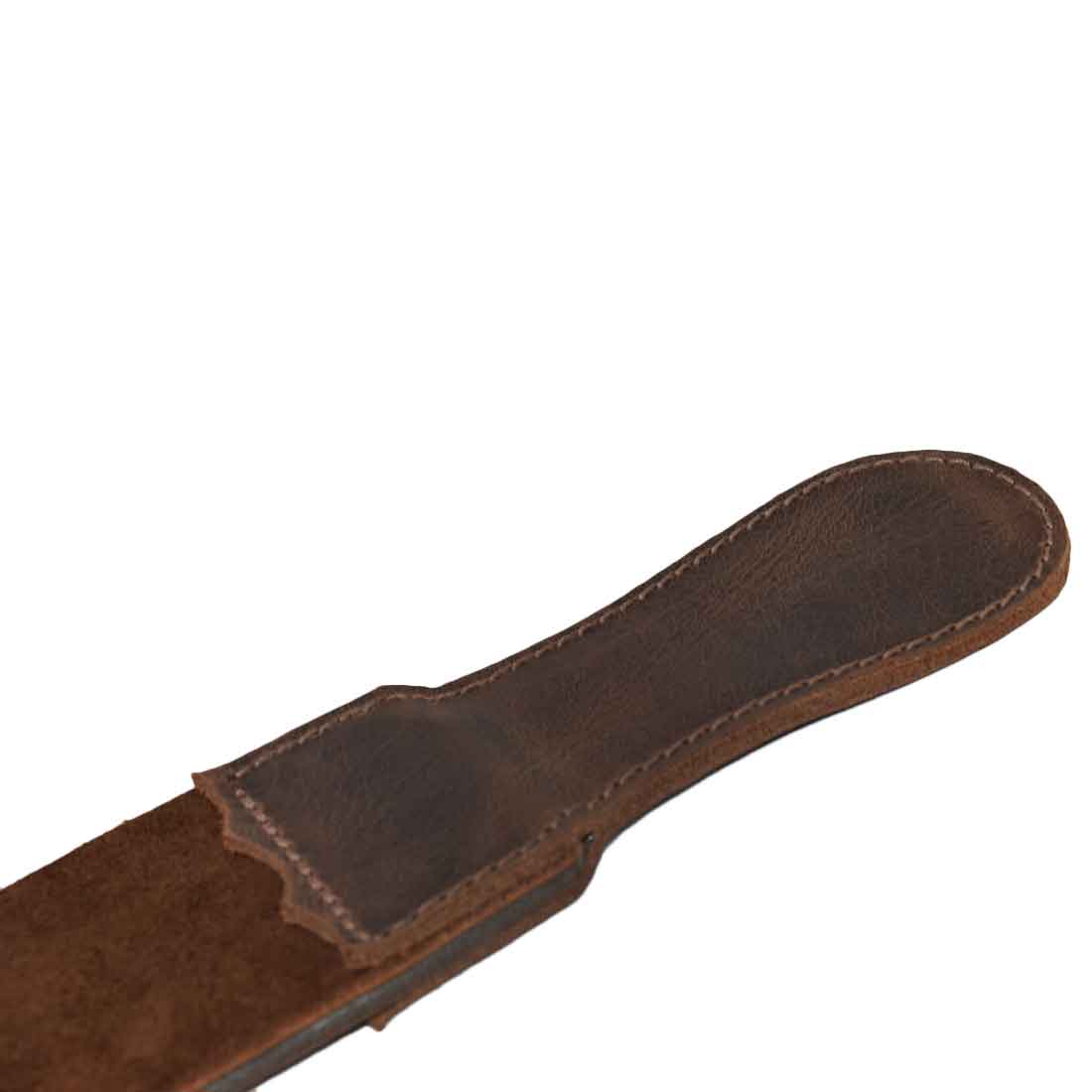 Close-up of the sturdy handle on Hide & Drink's Barber Strop, made from premium Full Grain Leather. This Razor Strop and Shaving Sharpener reflects small batch production and hand sewn details by artisans in La Antigua Guatemala.