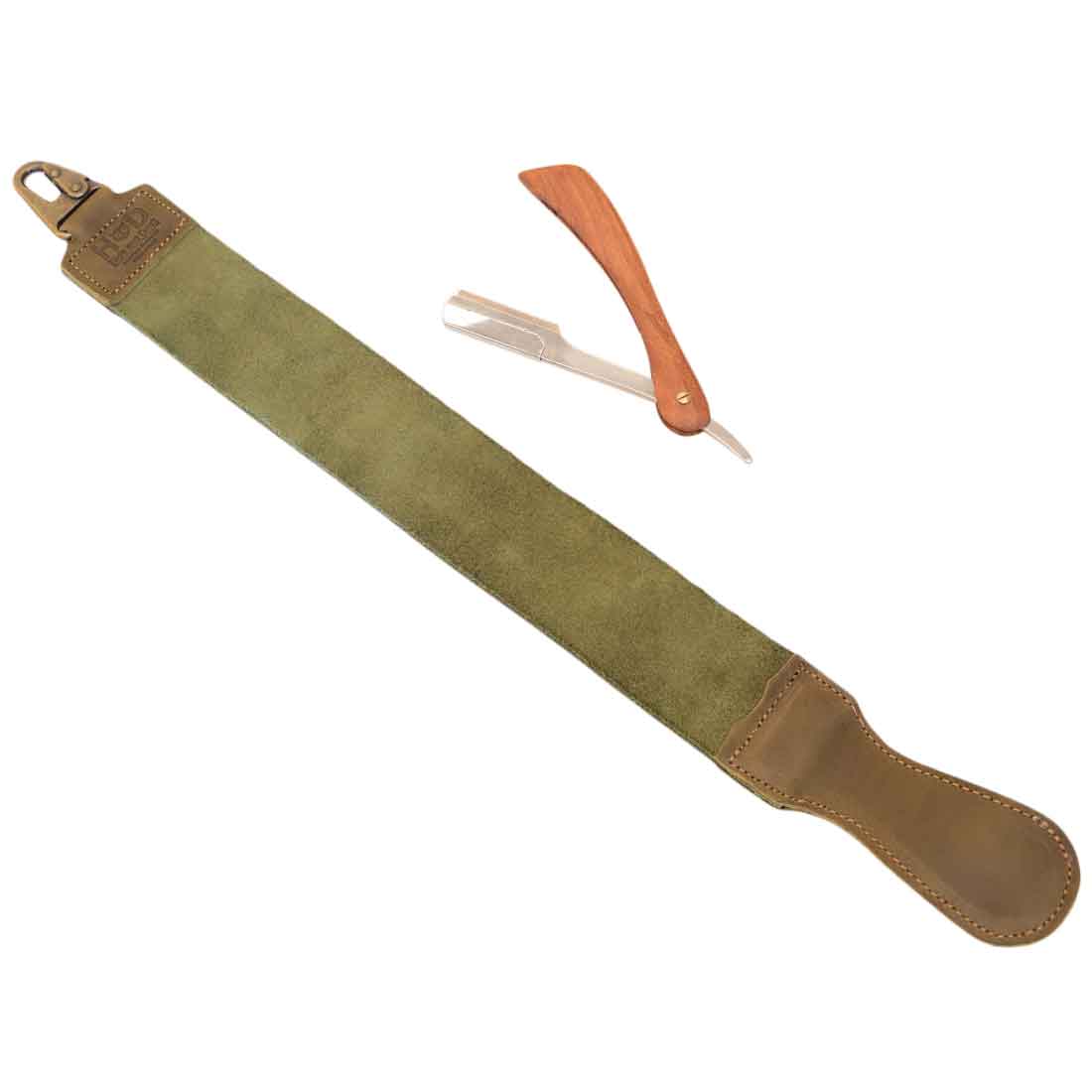 Hide & Drink's Olive Green Barber Strop laid out with a straight razor, emphasizing its versatile design. This Full Grain Leather shaving sharpener serves as both a Razor Strop and Barber Straight Razor Strap Belt.