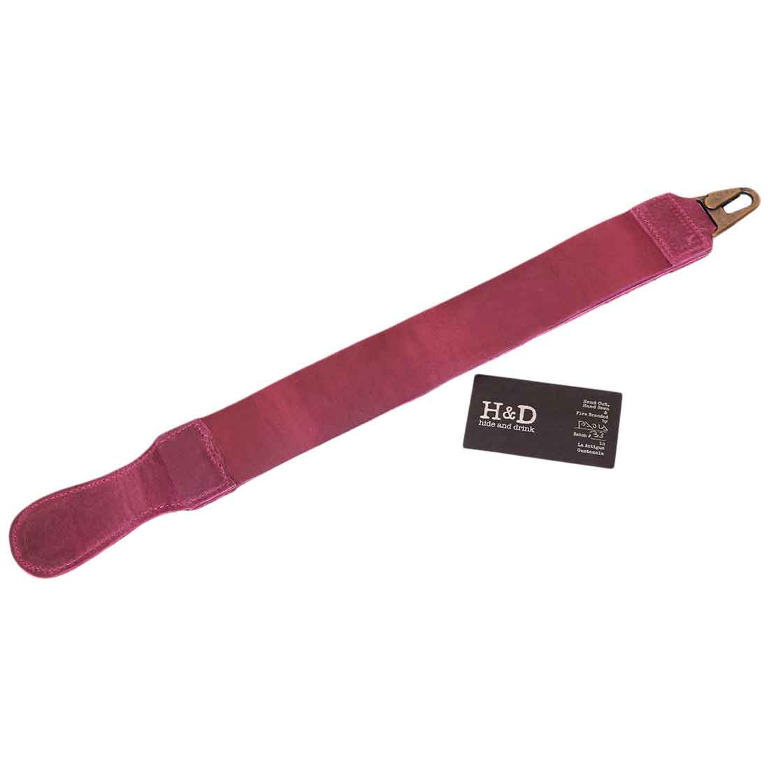 Hide & Drink's visible branding on their purple Barber Strop, made from quality Full Grain Leather. This shaving sharpener serves as a reliable Razor Strop, showcasing artisan craftsmanship.