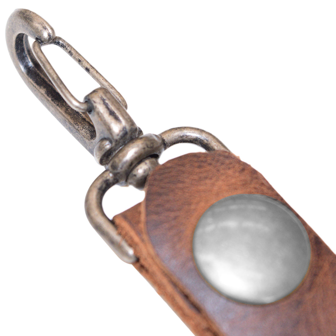 Detailed view of the Belt Key Holder by Hide & Drink highlighting the sturdy clasp and rich leather texture, built for lasting use. Dimensions Length: 4.25 in. Height: 1 in. Width: 0.50 in. This Full Grain Leather piece will develop an individual patina; conditioning is recommended with mineral oil or beeswax.