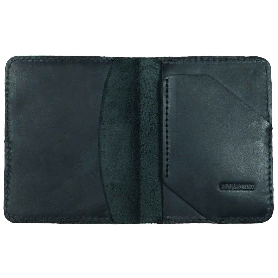 Inside of the Bi-Fold Card Wallet Diagonal by Hide & Drink in black, emphasizing minimalist features and durable design, showcasing its ability to store up to 5 cards plus folded bills, perfect for cash organization.