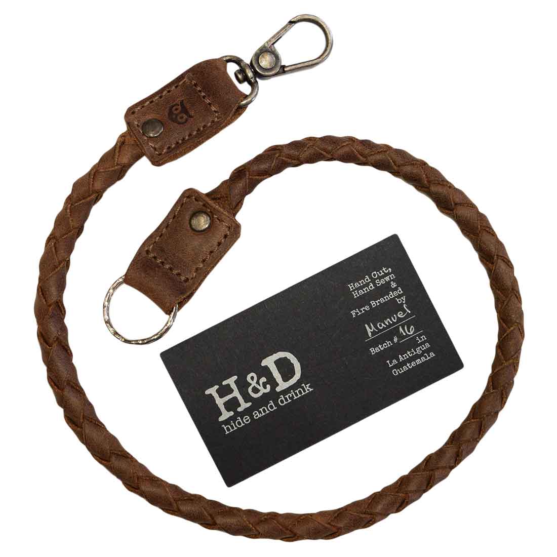 Biker Chain by Hide & Drink, a stylish braided keychain that doubles as a key lanyard for wallet. Made from premium full grain leather, this travel accessory represents small batch production with meticulous hand cut and hand sewn methods, proudly made by artisans in La Antigua Guatemala & Oaxaca Mexico.