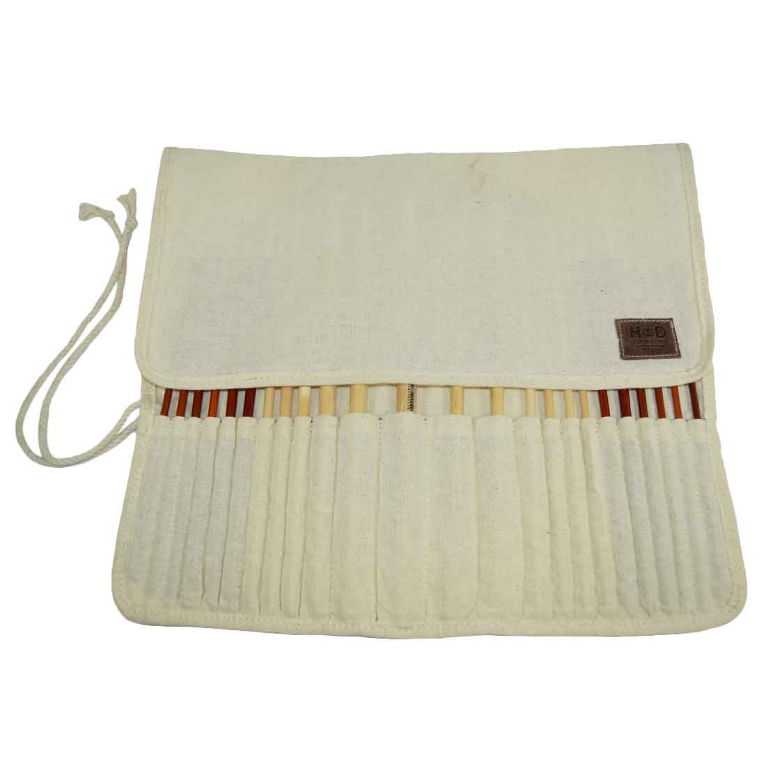 Paint Brush Roll-Up by Hide & Drink featuring a stylish flap design to keep brushes organized. This Artist Paint Brush Canvas Roll-Up with Leather Lining Storage Wrap / 24 Slots / Workshop Art Study is made with care in small batches, emphasizing artisan quality. Fire branded and handmade in La Antigua Guatemala & Oaxaca Mexico.