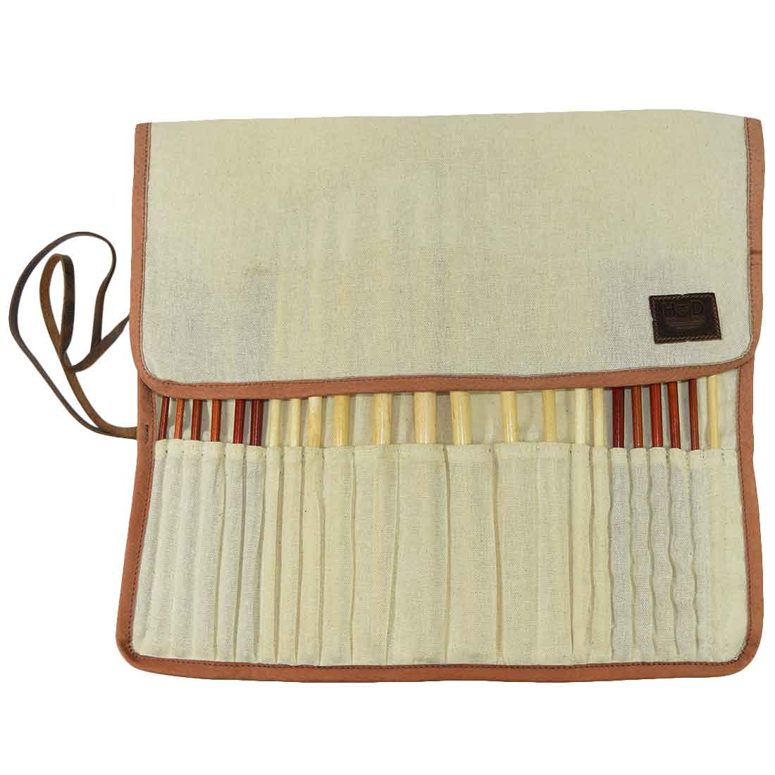 Folded Paint Brush Roll-Up by Hide & Drink showcasing a durable exterior designed for artists on the go. This Artist Paint Brush Canvas Roll-Up with Leather Lining Storage Wrap / 24 Slots / Workshop Art Study highlights the artistry of small batch production. Fire branded and handmade in La Antigua Guatemala & Oaxaca Mexico.