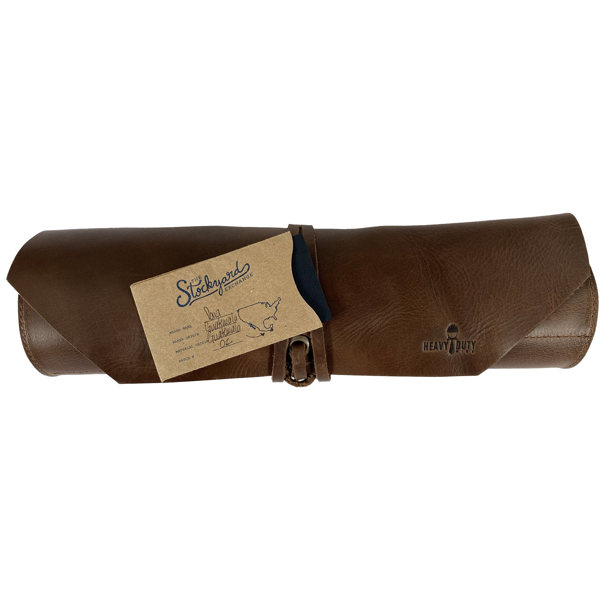 The 12 Pocket Tool Roll - Home Storage by Heavy Duty Hide, beautifully packaged with a card showcasing its artisan origins. This Big Tool Roll Up Bag combines durability and vintage style, perfect for workshop storage with its 12 slots for tools.