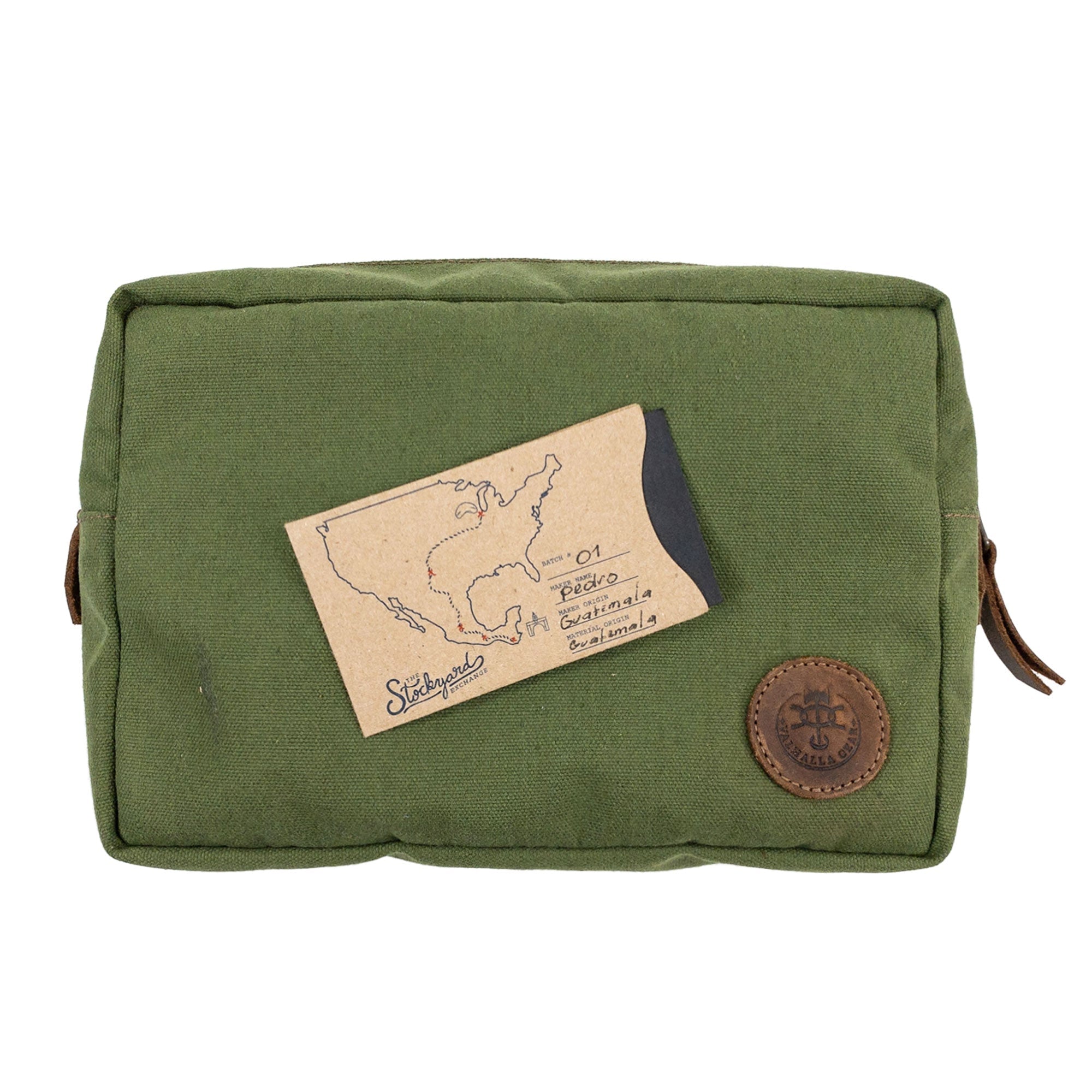 Top view of the Rectangular Utility Bag for Camping from Valhalla Gear, featuring its unique artisan tag, emphasizing handmade quality from water-resistant canvas and full grain leather in La Antigua Guatemala.