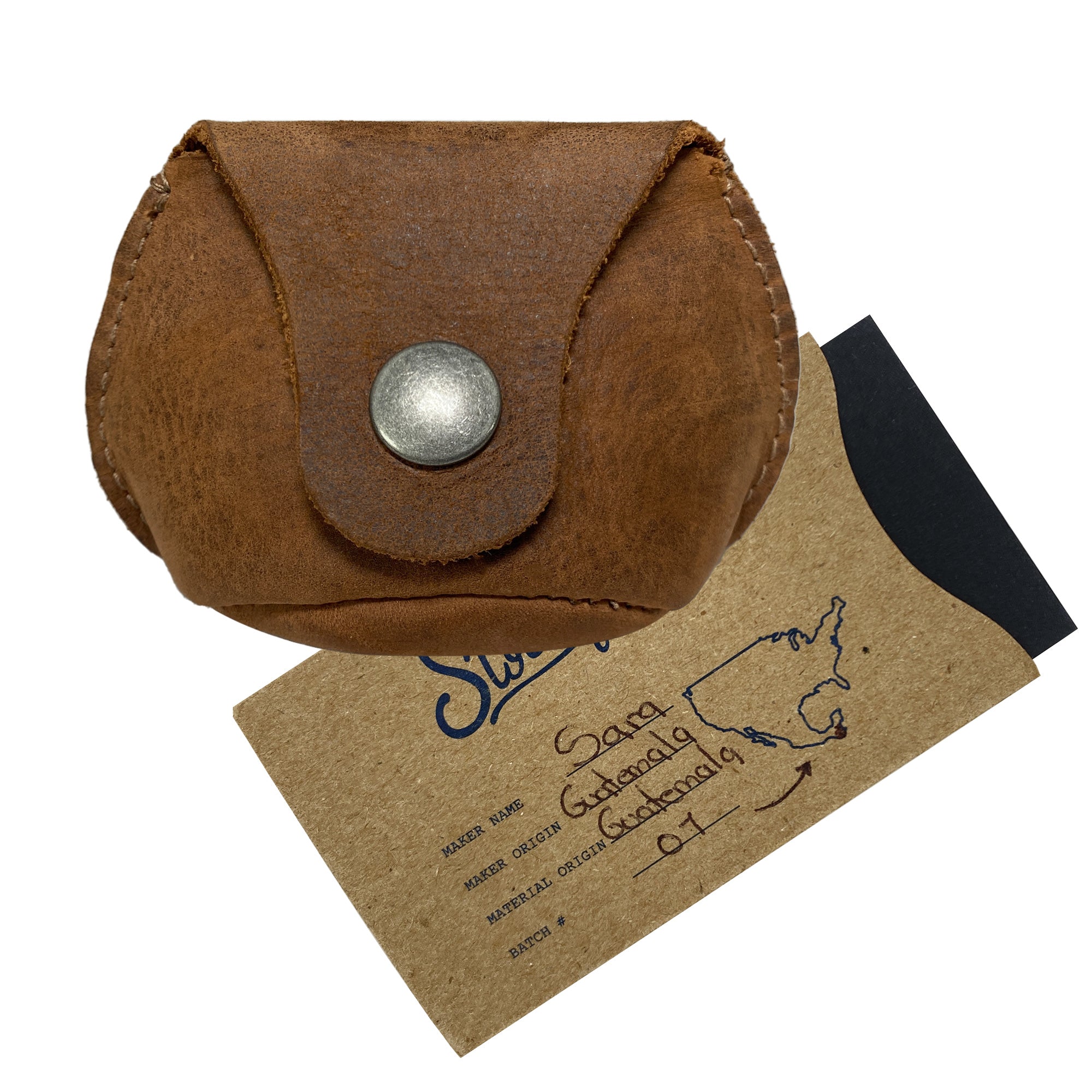 Simple Coin Pouch by Hide & Drink alongside its packaging, emphasizing artisan craftsmanship and quality. The Full Grain Leather pouch is designed for functionality as an EarPods Case, SD Card Holder, and Cash Organizer, highlighting the small-batch production philosophy of StockyardX and its handmade origins in La Antigua Guatemala & Oaxaca Mexico.