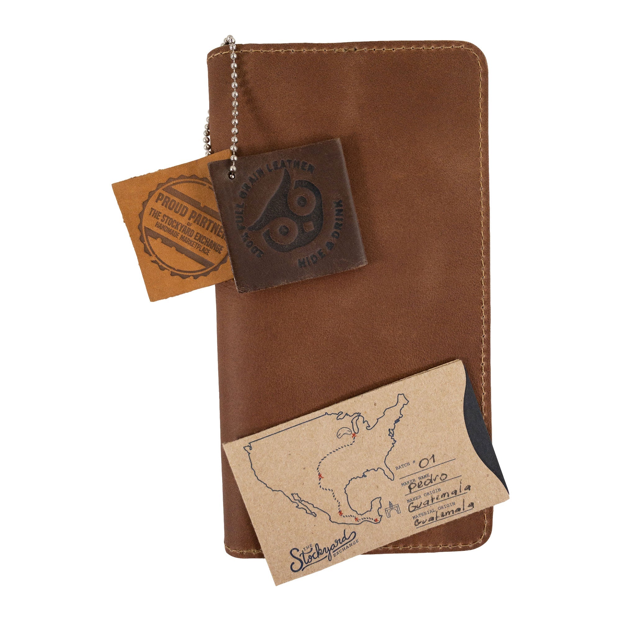 Hide & Drink Large Organizer Wallet open, revealing card slots and an elegant interior. This artisan-made bifold wallet is a stylish travel accessory, crafted from premium full grain leather, highlighting craftsmanship in La Antigua Guatemala & Oaxaca Mexico.