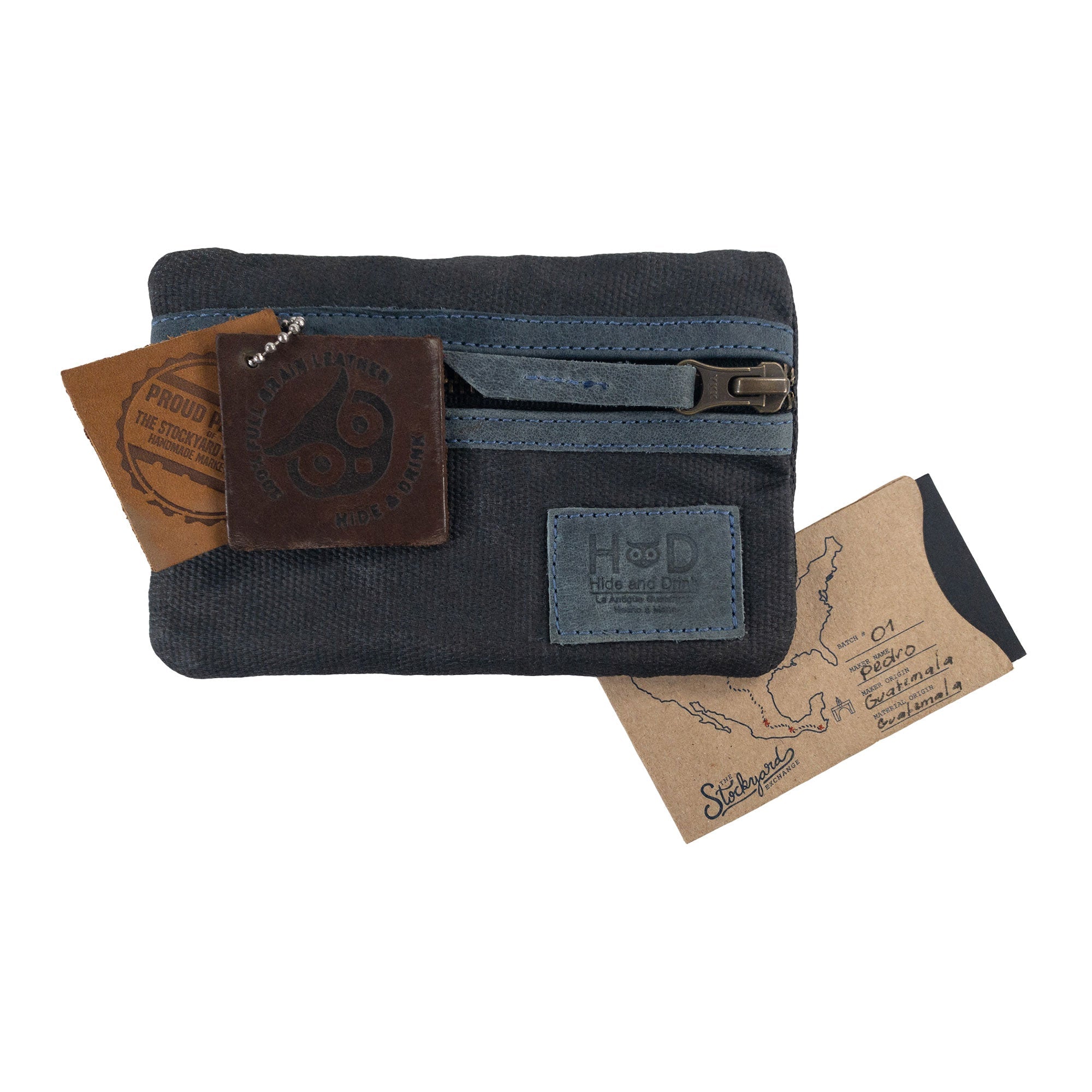 Packaging of the dark grey Multi-tool Pocket Pouch by Hide & Drink, featuring tags emphasizing quality artisan craftsmanship.