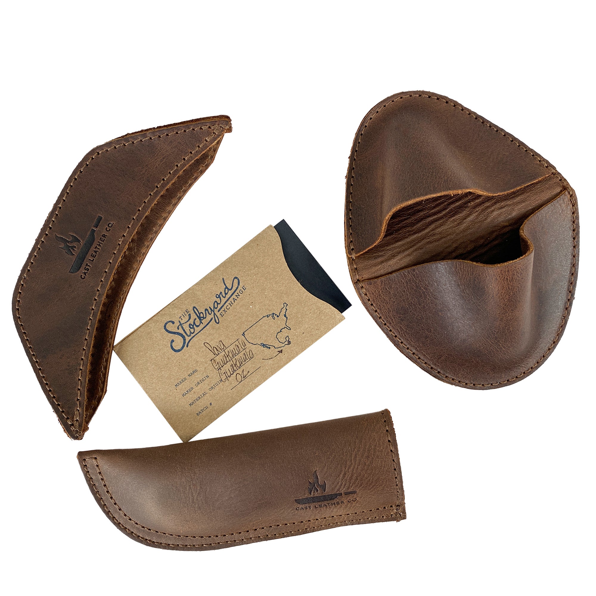 This image presents the Hot Handle Holders Set of 3 by Cast Leather Co., displaying each leather grip alongside a unique card that showcases their artisan roots. These full grain leather handles function as panhandles, side kicks, and grip mitts, yielding an assist grip for cast iron skillets and pans, masterfully created through handmade techniques in La Antigua Guatemala & Oaxaca Mexico.