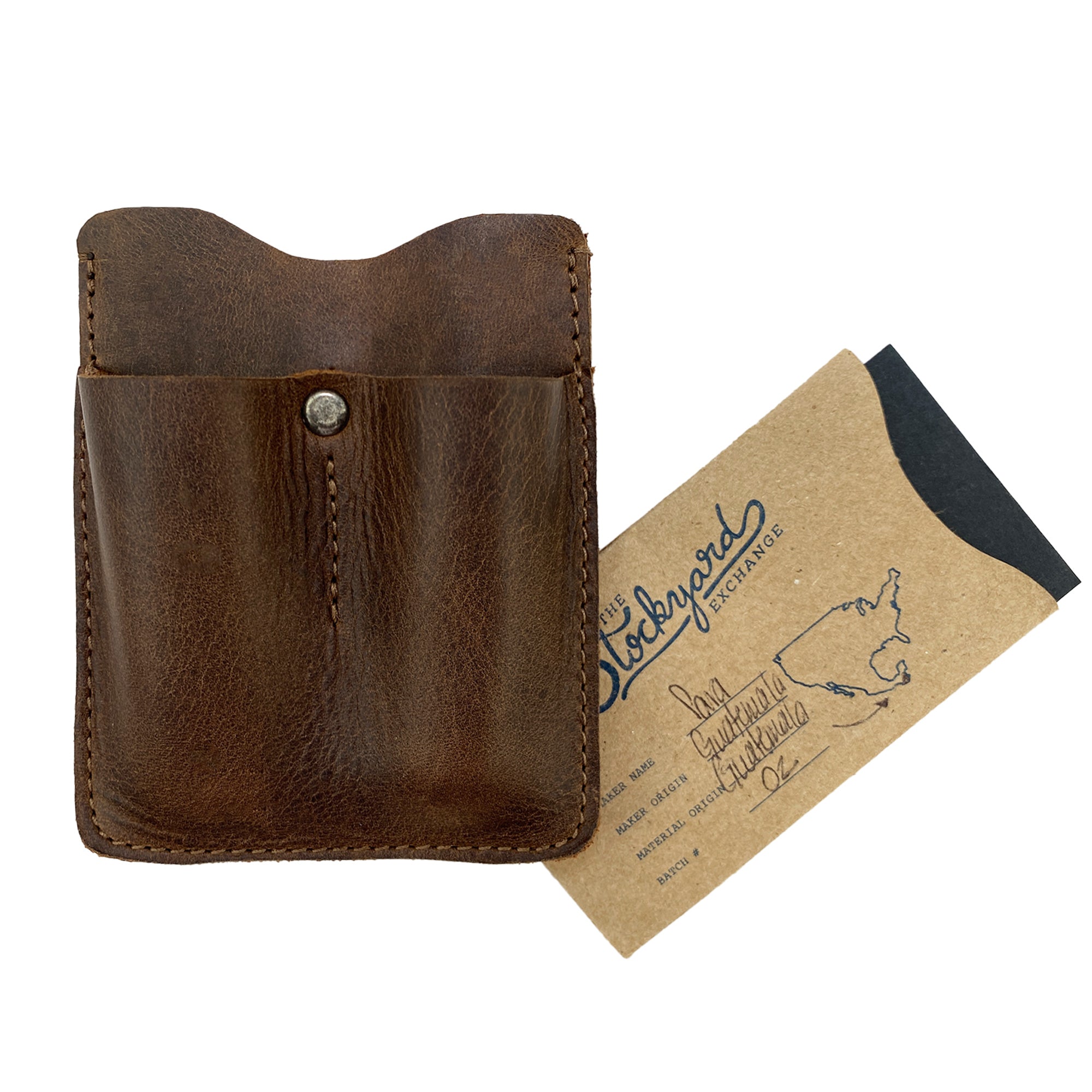 The Hide & Drink Card Holder with Small Tool Slots accompanied by its branded packaging. This artisan-crafted full grain leather card holder is perfect for organizing workshop accessories like knives and flashlights, made in small batches in La Antigua Guatemala.