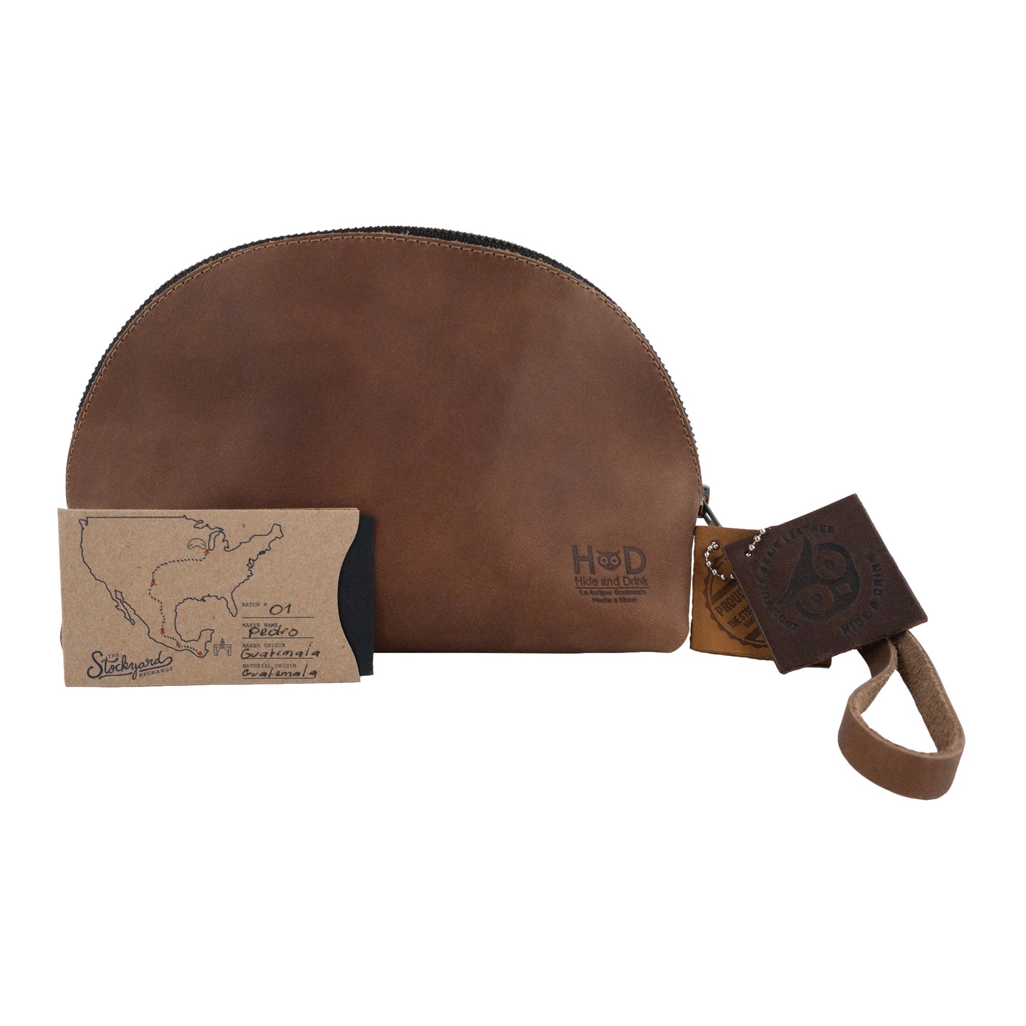 Accessory Pouch Organizer Hand Bag by Hide & Drink in a rich brown color, featuring full grain quality. This versatile Cosmetic Travel Organizer with Hand Strap for Women doubles as a Makeup Bag and Classic Handbag, showcasing artisan craftsmanship from La Antigua Guatemala & Oaxaca Mexico.