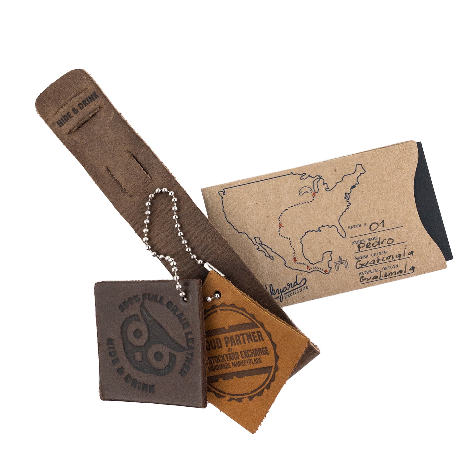 Close-up of the Hide & Drink Minimalist Wristband with authentic leather tags, emphasizing its rustic appeal and adjustable strap. Handmade with full grain leather, this stylish cuff embodies the artisan tradition of small batch production by StockyardX in La Antigua Guatemala.