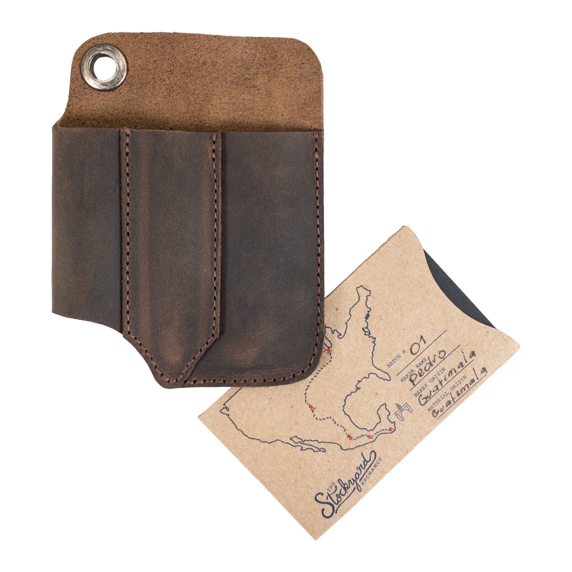 Compact EDC Tool Holster from Valhalla Gear shown with its authenticity card, highlighting craftsmanship. This full grain leather pocket case serves as a rustic sleeve for tools, made through artisan small batch production in La Antigua Guatemala.