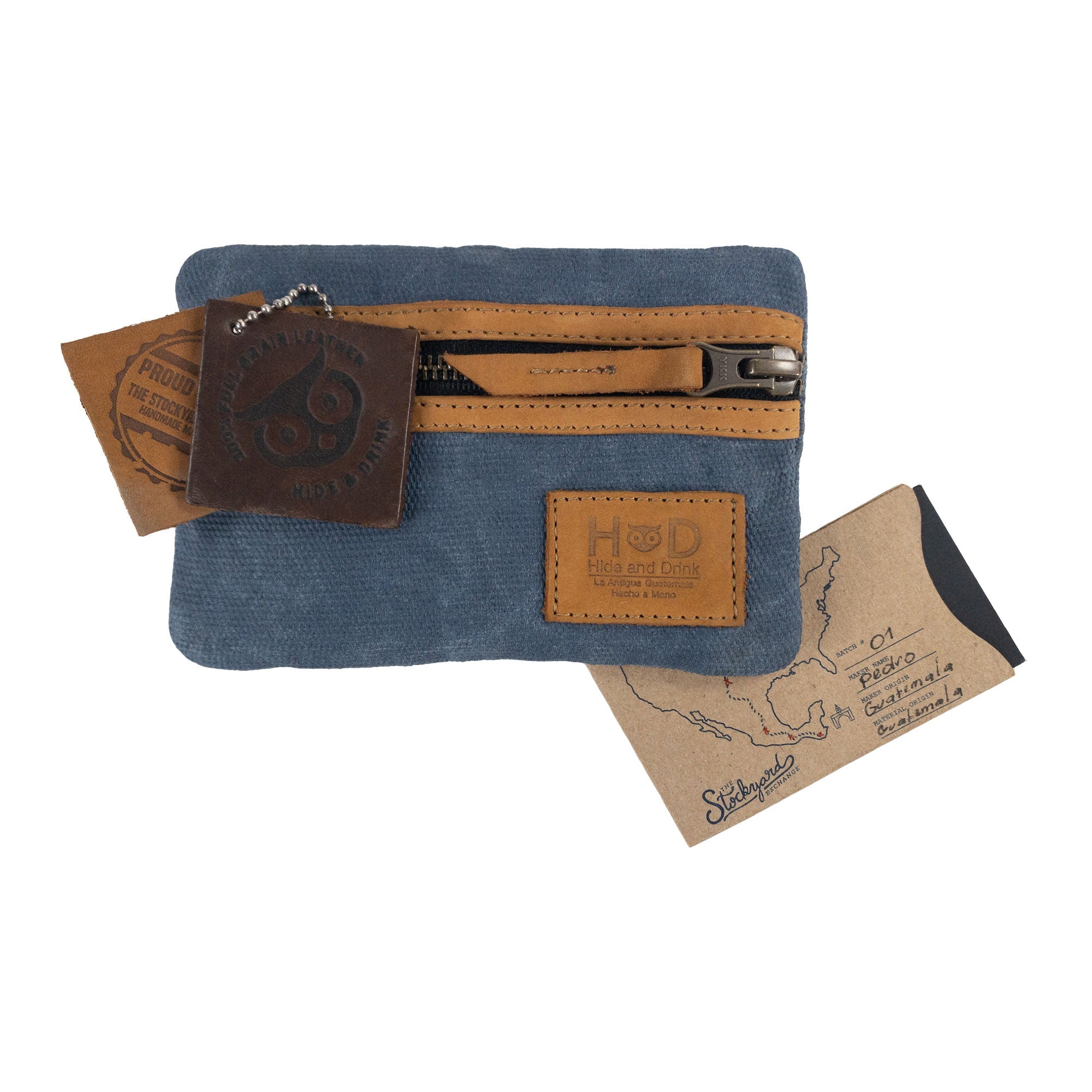 Packaging of the grey Multi-tool Pocket Pouch by Hide & Drink, showcasing its artisan heritage with quality tags.