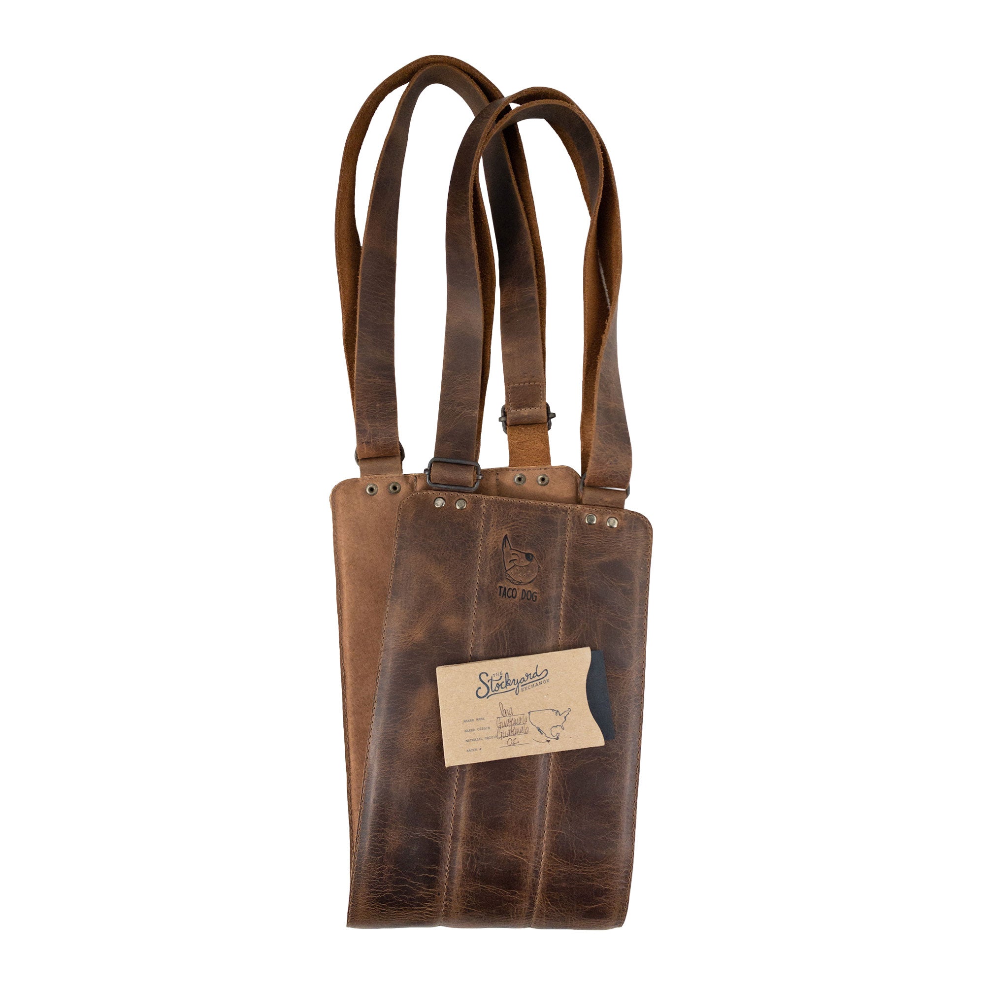 Rustic Dog Lift Harness by Taco Dog displayed with packaging, revealing its artisan quality and Full Grain Leather material. This handmade support tool is designed for pet rehabilitation, ideal for dogs needing assistance. Each harness is carefully crafted in small batches, reflecting the dedication of artisans from La Antigua Guatemala & Oaxaca Mexico.