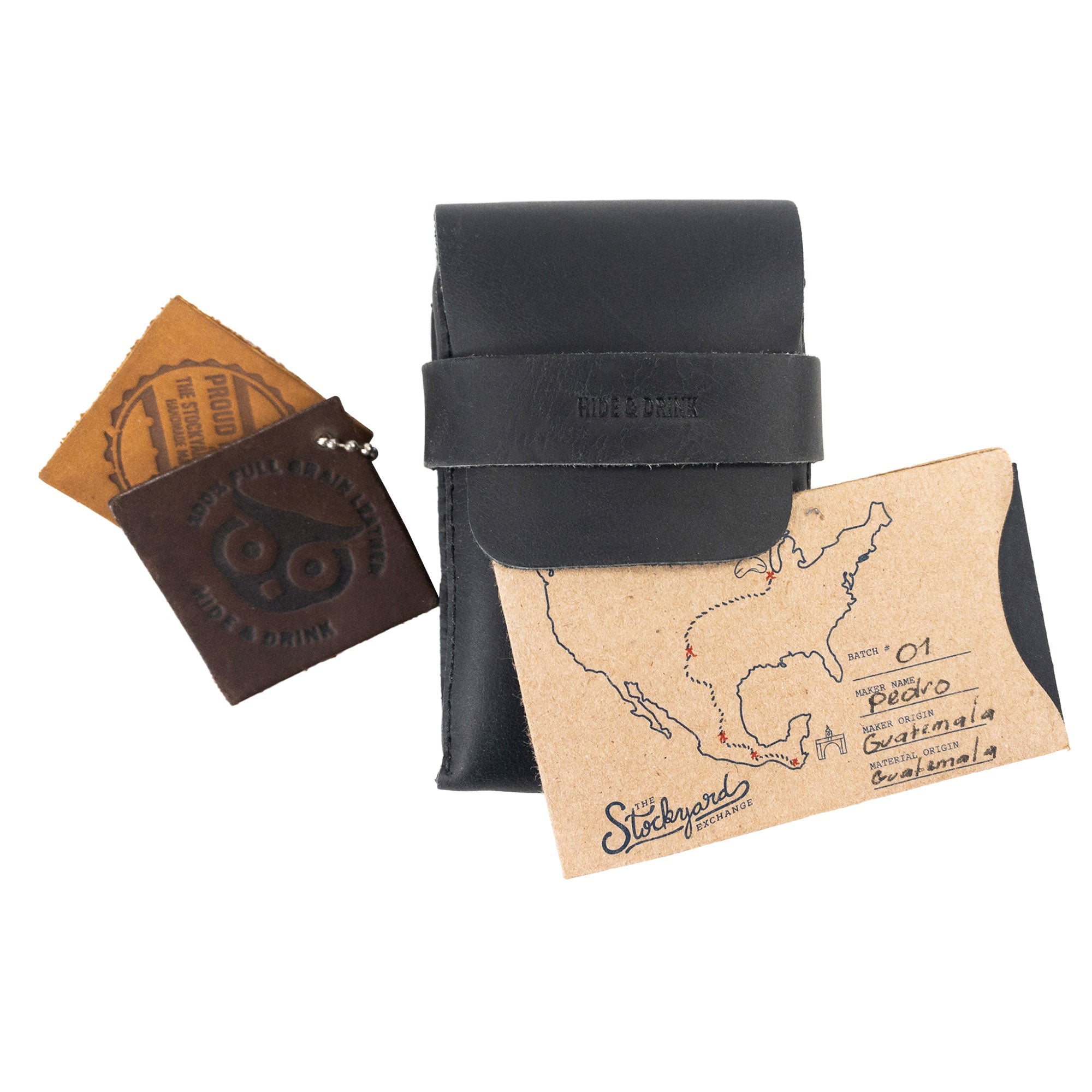 Hide & Drink's Playing Card Case alongside a card and branded materials. This classic case for playing cards (not included) is an ideal travel accessory, featuring secure storage in full grain leather. Handmade by artisans, this product from StockyardX represents high-quality craftsmanship from La Antigua Guatemala.
