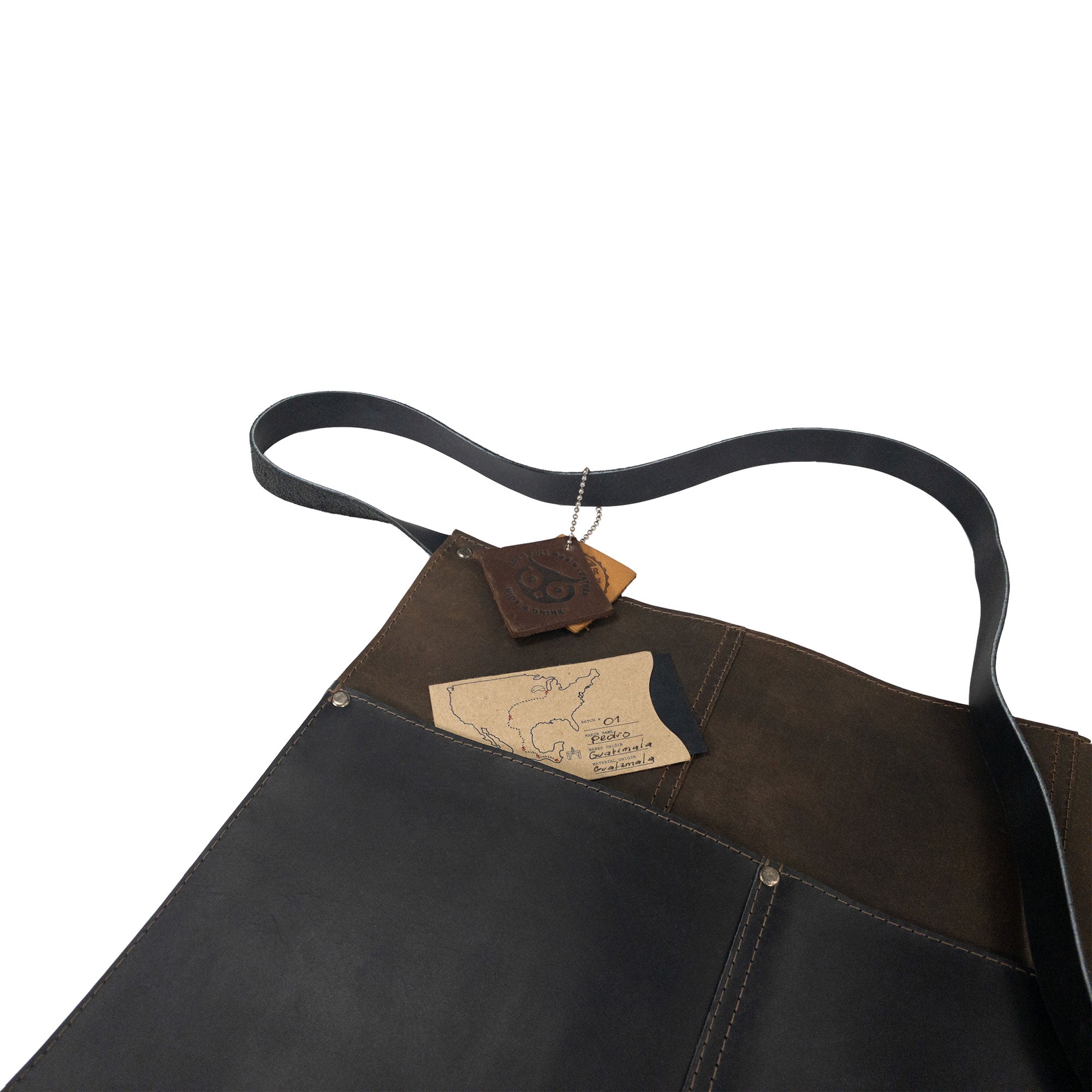 Detail view of the Hide & Drink Barista Leather Waist Apron, showing its riveted pockets, suitable for waitress and waiter accessories. Handmade from full grain leather with artisan craftsmanship in La Antigua Guatemala & Oaxaca Mexico.