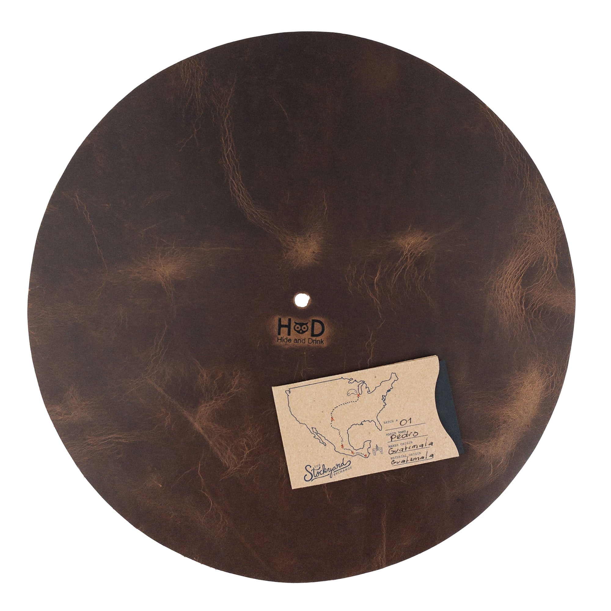 Hide & Drink Turntable Slipmat presenting detailed craftsmanship, made from durable full grain leather with a fire branded logo. This classy turntable slipmat not only reduces noise and static but also adds a unique, handmade artisan touch to any vinyl collection.