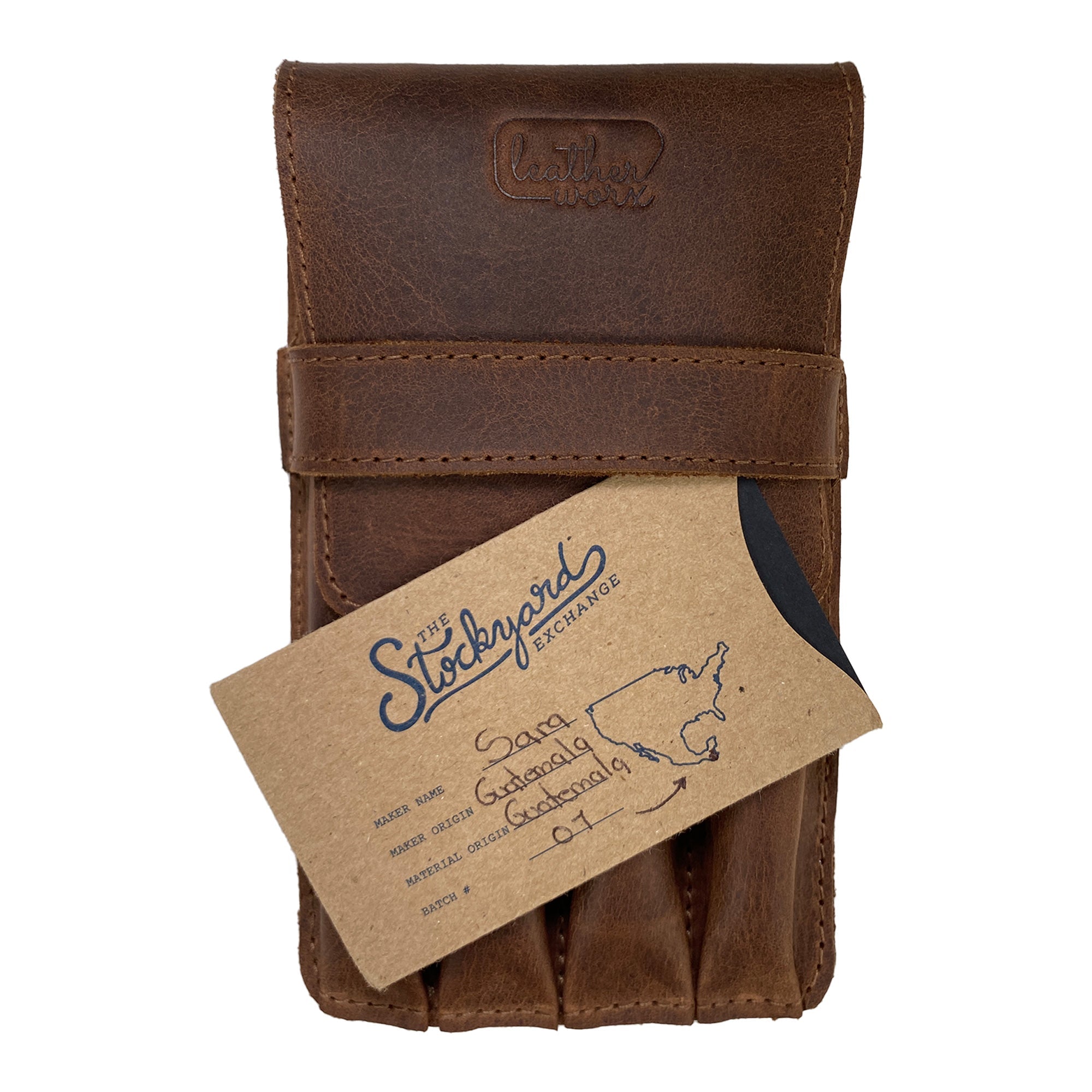 Leather Worx 4-Pen Holder in brown leather with a gift card from The Stockyard Exchange, showcasing its elegant design and function. This classic storage solution embodies small batch production and artisanal quality, featuring hand cut and sewn techniques from La Antigua Guatemala.