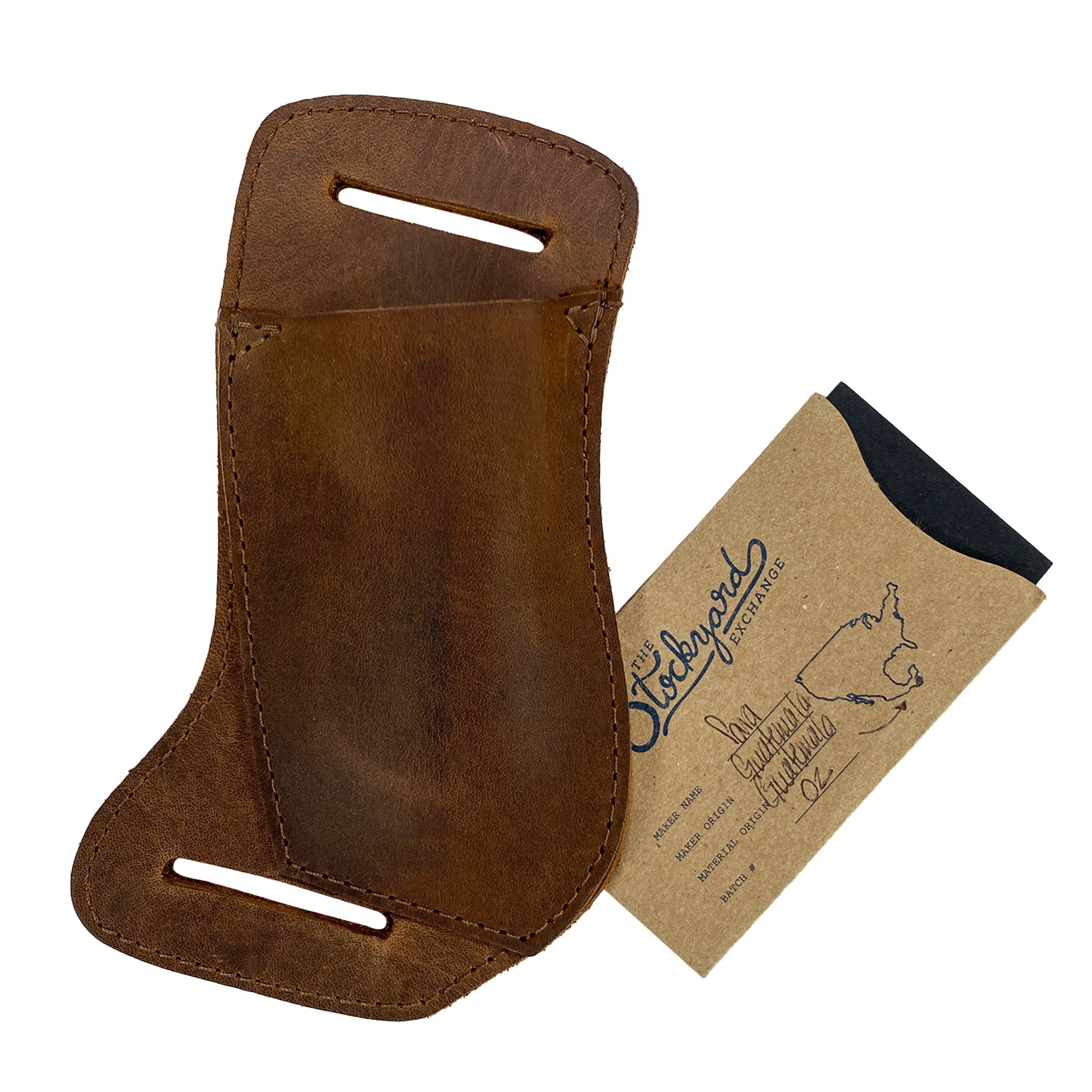The Valhalla Gear Horizontal Knife Holster displayed with its packaging, underscoring its artisan quality and handmade craftsmanship, sourced from La Antigua Guatemala and Oaxaca Mexico, in premium full grain leather. This Horizontal Knife Holster - Multitool Holder, Tool Case, Camping & Outdoor Accessories, Full Grain Leather, StockyardX, Small Batch Production, Hand Cut, Hand Sewn, Fire Branded, Artisan, Handmade in La Antigua Guatemala & Oaxaca Mexico.