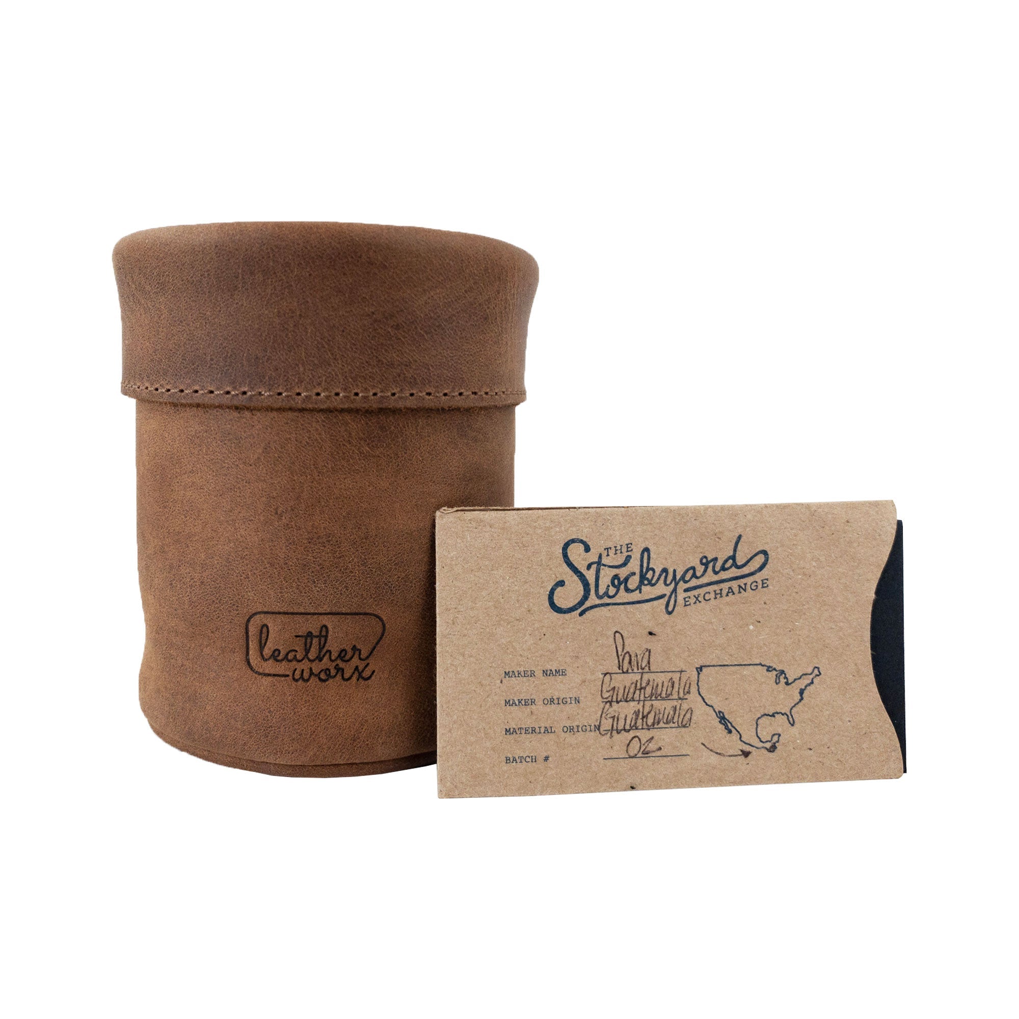 Leather Worx Pen Organizer next to a card detailing its origin. This Pen Organizer Cylinder Pencil Holder represents the quality of Full Grain Leather work accessories, highlighting artisan skills and small batch production from La Antigua Guatemala & Oaxaca Mexico.