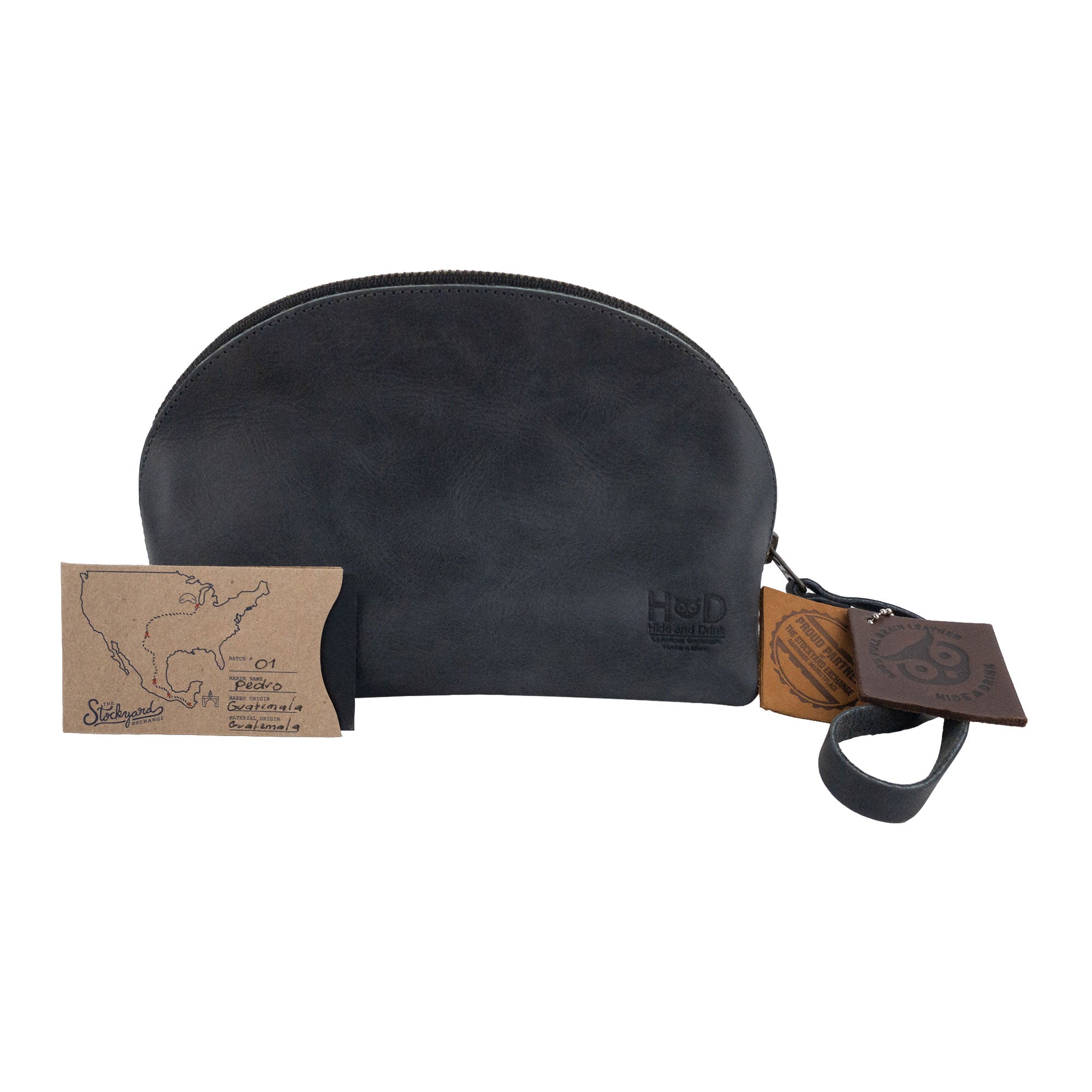 Accessory Pouch Organizer Hand Bag by Hide & Drink in black leather, accompanied by business cards emphasizing craftsmanship. This Cosmetic Travel Organizer with Hand Strap for Women acts as a versatile Makeup Bag and Classic Handbag, handmade in La Antigua Guatemala & Oaxaca Mexico.