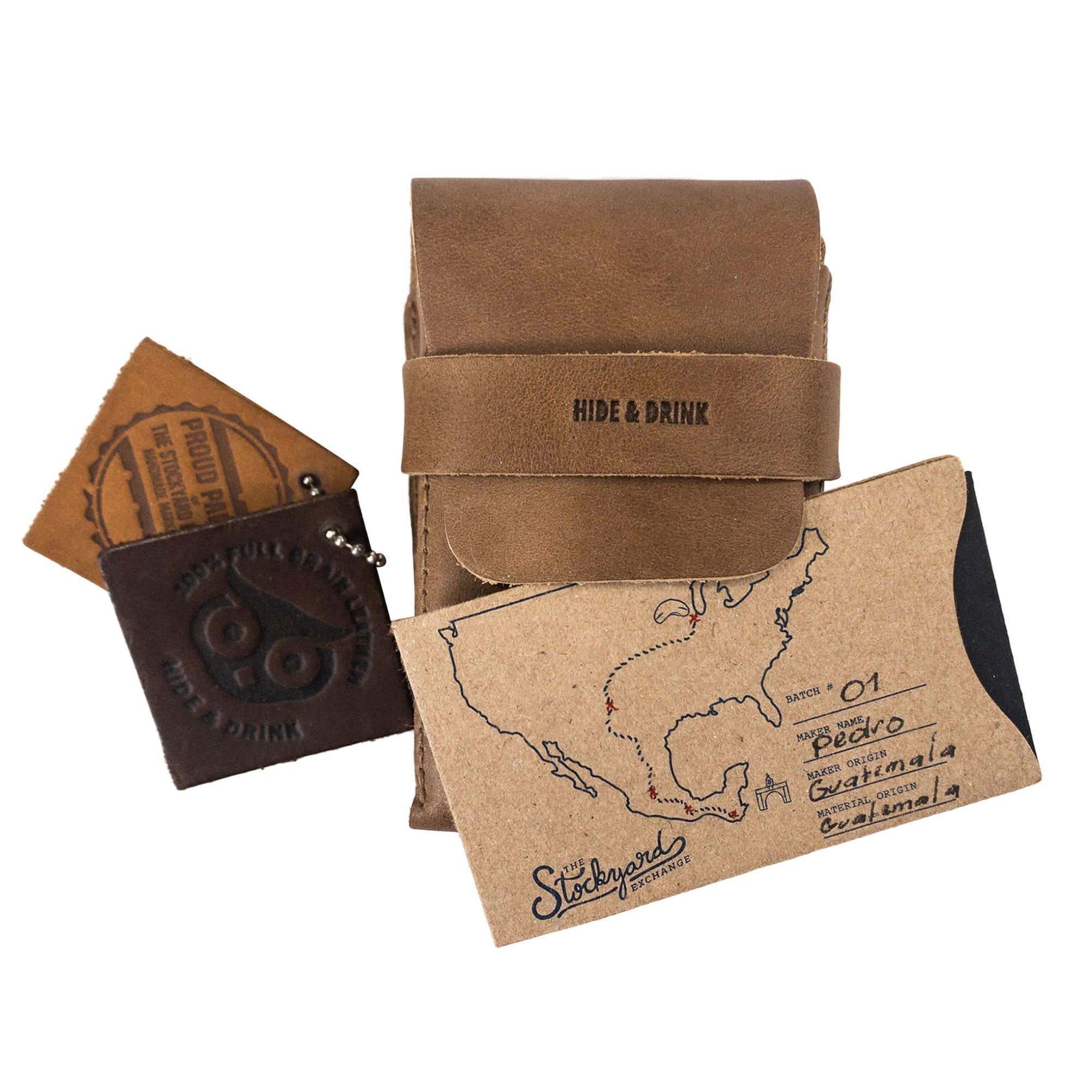 Hide & Drink's brown Playing Card Case packaged with branded materials. This classic case for playing cards (not included) ensures secure storage, made from durable full grain leather. Artisan crafted and handmade from StockyardX, it represents top-notch craftsmanship.