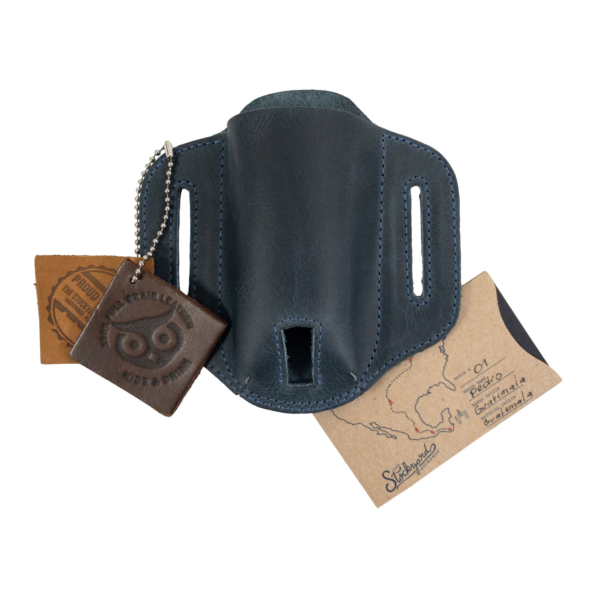 Tag accompanying the navy Multitool Belt Sheath by Hide & Drink, highlighting the origin and craftsmanship. This outdoor accessory is made from full grain leather, making it a unique pocket knife set case and exemplary of small batch production.