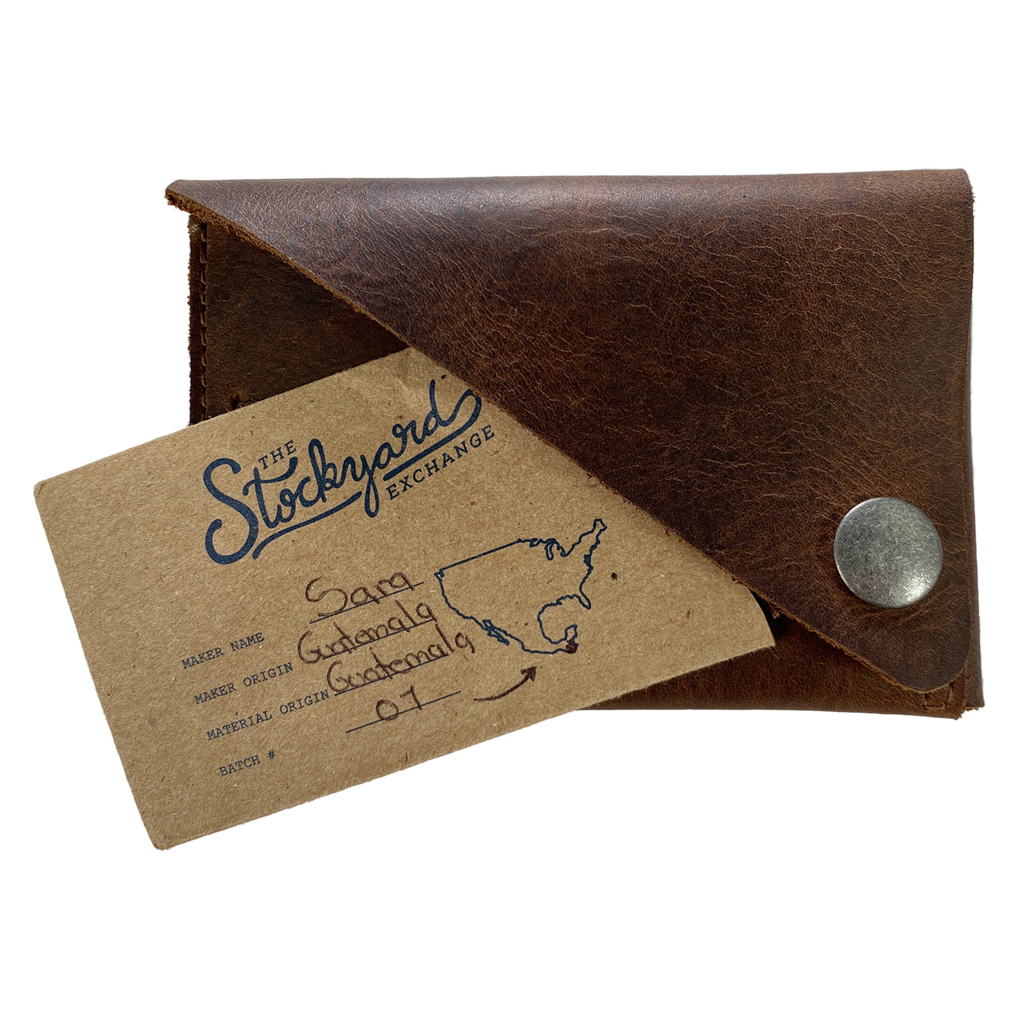 Hide & Groom Minimalist Wallet displayed with a business card, emphasizing its stylish and functional design made from full grain leather. This wallet reflects the artisanal quality and craftsmanship from La Antigua Guatemala, perfect for any occasion. Minimalist Wallet - Business Card & Money Holder, Stylish Compact Money Organizer, Full Grain Leather, StockyardX, Small Batch Production, Hand Cut, Hand Sewn, Fire Branded, Artisan, Handmade in La Antigua Guatemala & Oaxaca Mexico.