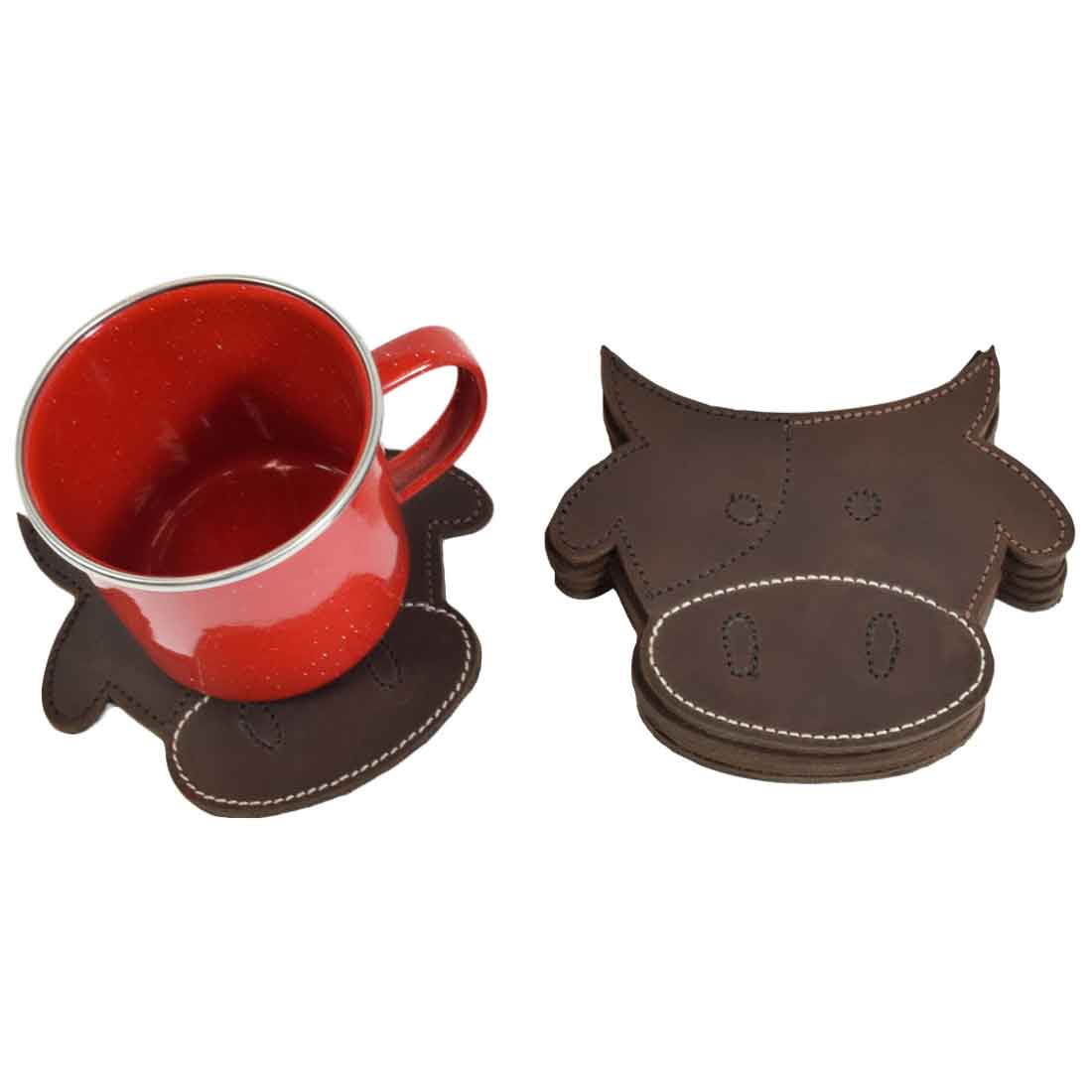 A red mug placed on one of the cute Milk Cow Coasters from the Milk Cow Coaster Set (6-Pack) by Hide & Drink, emphasizing the durable craftsmanship of these thick leather coasters. Ideal for coffee lovers and animal enthusiasts. Durable Thick Leather Milk Cow/Animal Farm Cute Shaped Coasters (6-Pack) Full Grain Leather, StockyardX, Small Batch Production, Hand Cut, Hand Sewn, Fire Branded, Artisan, Handmade in La Antigua Guatemala & Oaxaca Mexico.