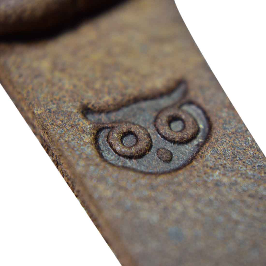 Close-up detail of Hide & Drink's Cat Toy featuring the signature owl branding. This cute Cat Teaser is made with care, showcasing full grain leather and reflects the artisan's touch. Perfect for playful cats, this handcrafted Furry Mouse is an ideal gift for cat lovers. Made in La Antigua Guatemala, this toy represents small batch production and dedication to quality.