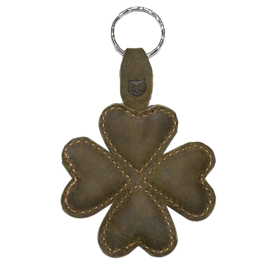 Detailed shot of the St. Patrick's - Lucky Clover Keychain by Hide & Drink, showcasing its unique four-leaf clover design. This good luck keyring is expertly hand cut and hand sewn, crafted from full grain leather in small batches, celebrating artisan techniques.