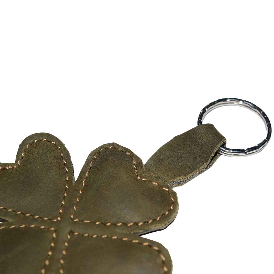 Close-up of the St. Patrick's - Lucky Clover Keychain by Hide & Drink, showcasing the hand-stitched details. This good luck keyring is crafted from durable full grain leather, reflecting the artisan spirit of small batch production in La Antigua Guatemala and Oaxaca Mexico.
