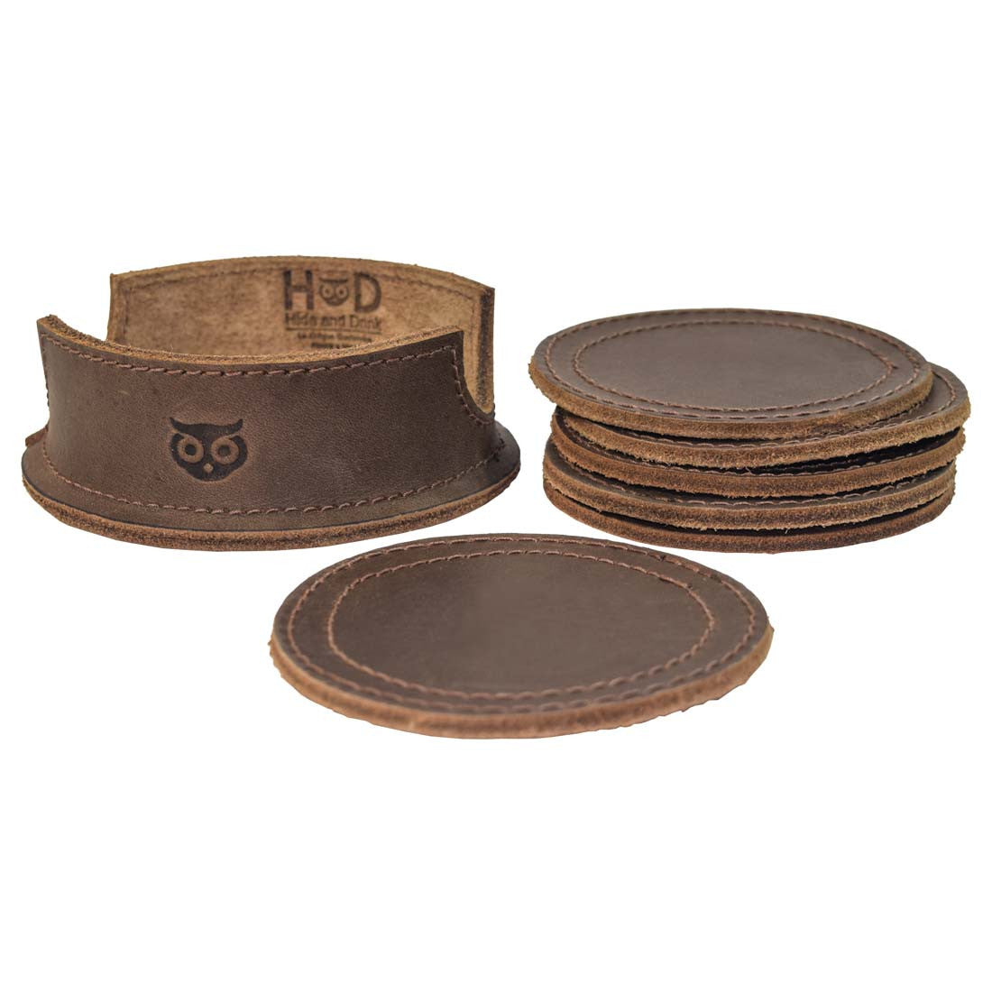 Thick Leather Coasters (6-Pack) by Hide & Drink, a complete set of circular coasters accompanied by a stylish holder. Crafted from full grain leather, these artisan coasters highlight small batch production and hand cut and hand sewn techniques, fire branded and handmade in La Antigua Guatemala.