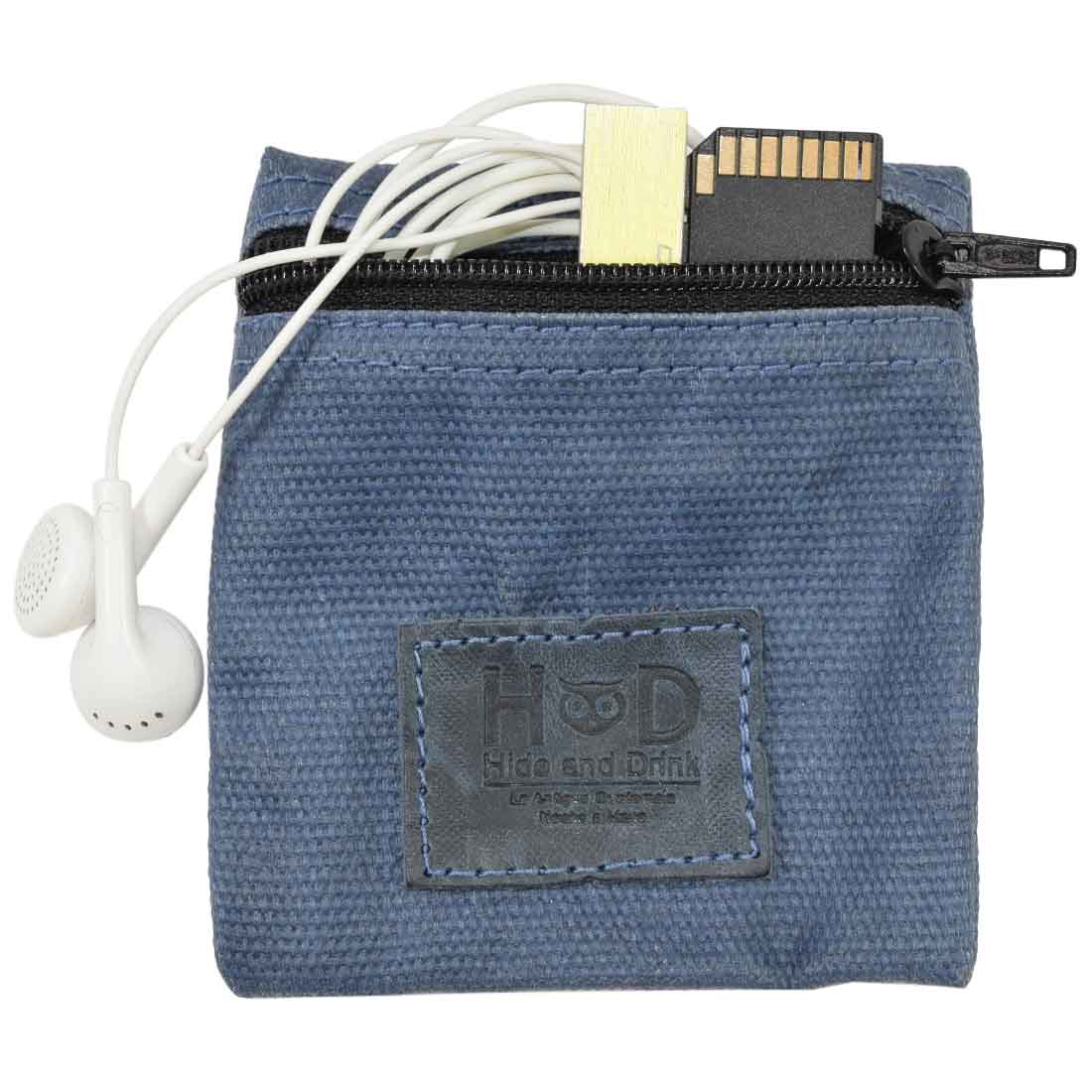 Hide & Drink Condom Pouch with earphones and a memory card, featuring stylish water resistant waxed canvas. Ideal as a handy tech pocket and classic partner gift, this handmade item offers practical travel solutions. Crafted in La Antigua Guatemala with artisan precision.