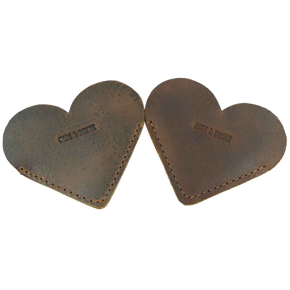 Two Leather Corner Heart Bookmarks (2 pack) by Hide & Drink, demonstrating unique designs in Full Grain Leather. These artisan bookmarks are handmade in La Antigua Guatemala and Oaxaca Mexico, reflecting a commitment to small batch production.