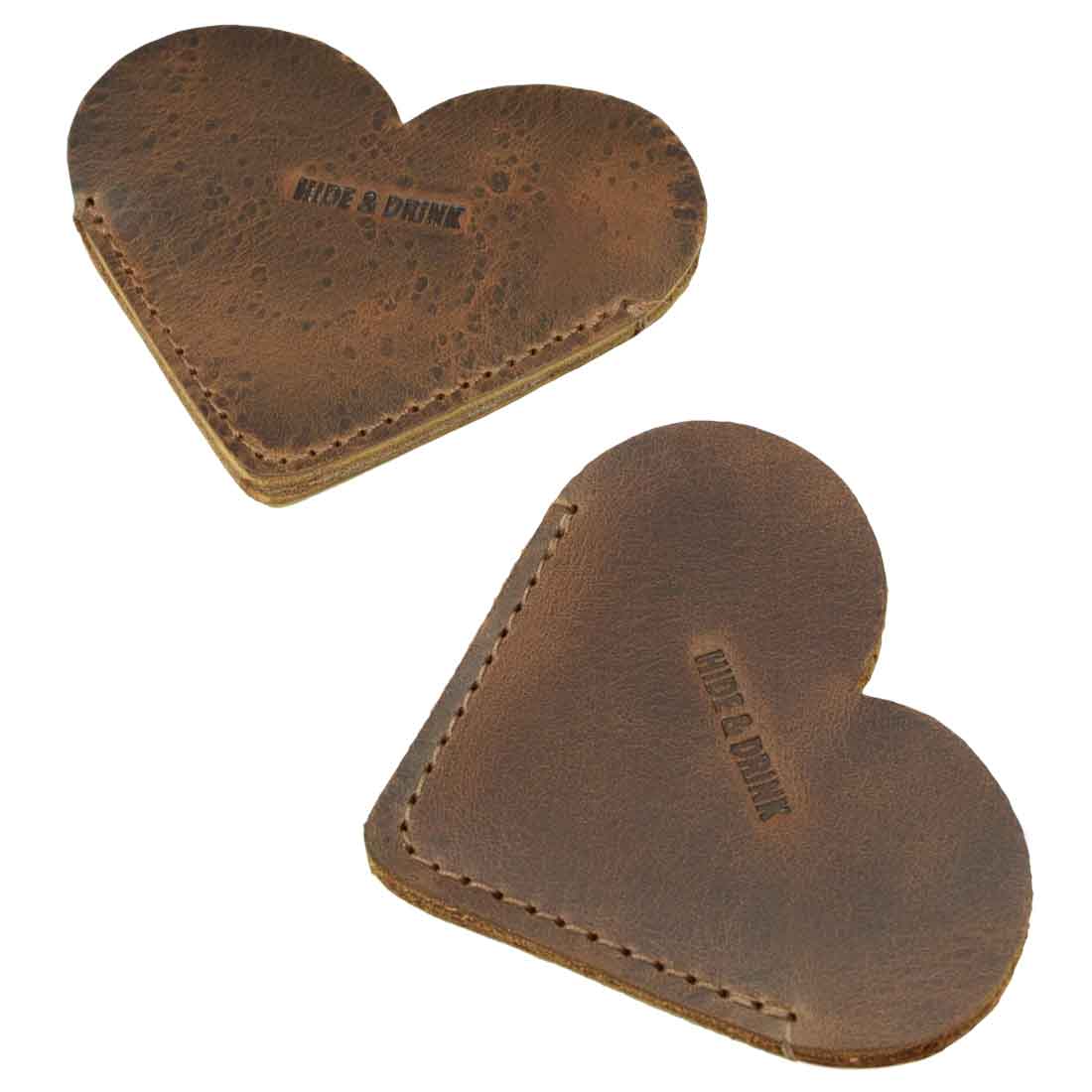 Close-up of Leather Corner Heart Bookmarks (2 pack) by Hide & Drink, constructed from Full Grain Leather. These bookmarks are handcrafted in La Antigua Guatemala and Oaxaca Mexico using hand cut and hand sewn techniques.