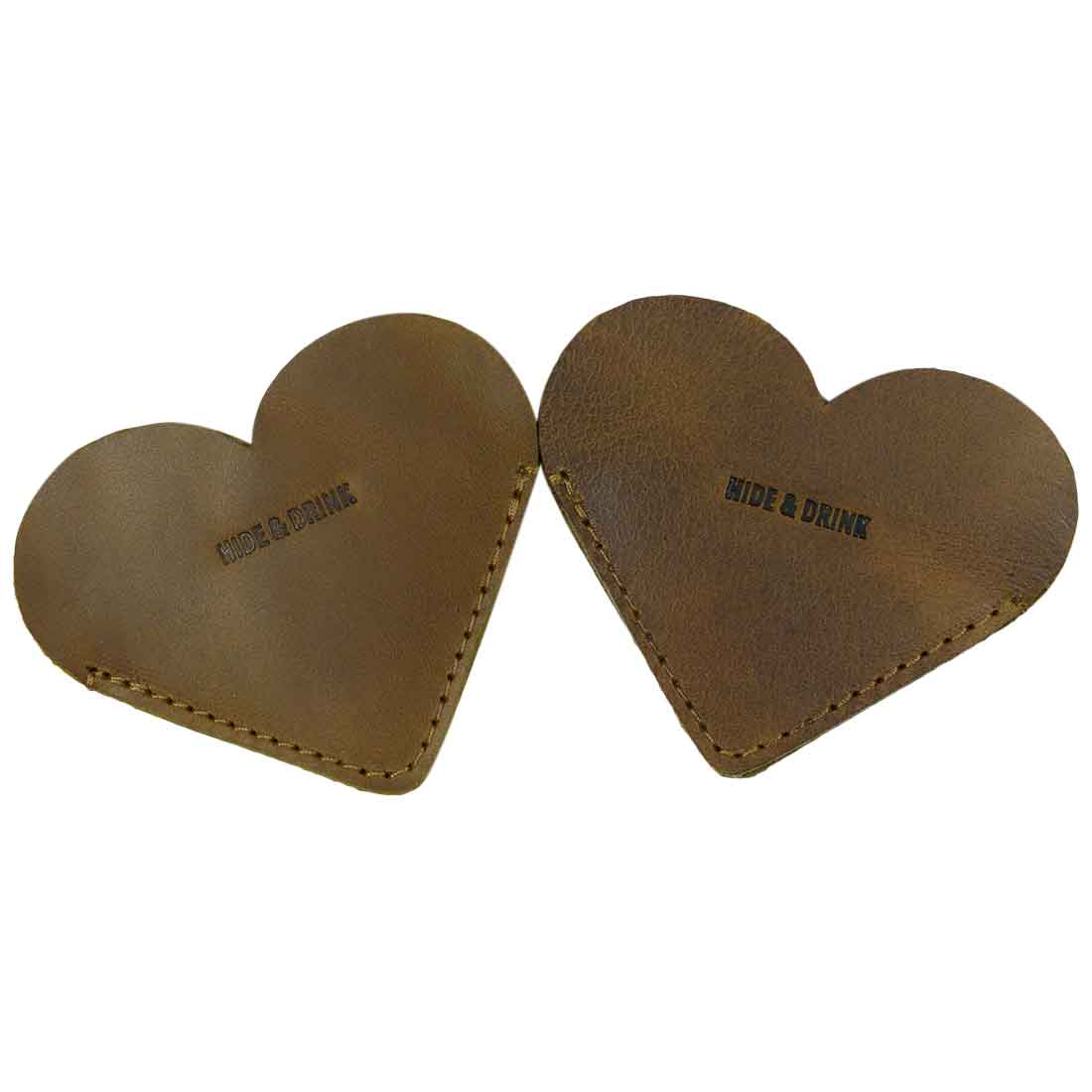 Two tan Leather Corner Heart Bookmarks (2 pack) by Hide & Drink, showcasing soft Full Grain Leather. Handmade in La Antigua Guatemala and Oaxaca Mexico, these bookmarks exemplify artisan craftsmanship and small batch production.