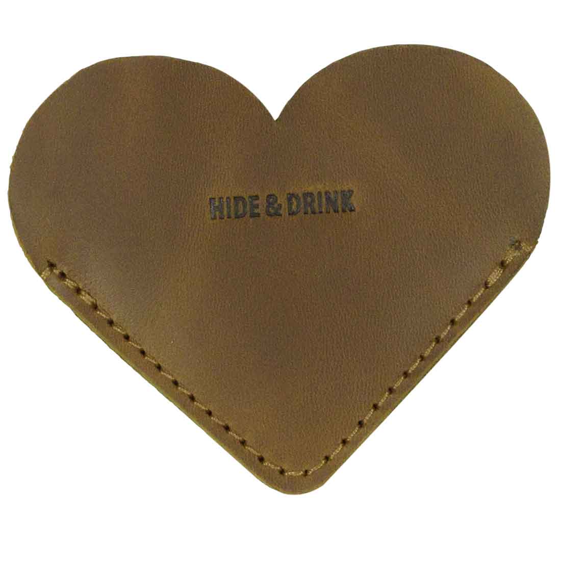 Close-up of a tan Leather Corner Heart Bookmark (2 pack) by Hide & Drink, highlighting its lovely Full Grain Leather texture. This handmade item represents artisan quality and small batch production from La Antigua Guatemala and Oaxaca Mexico.