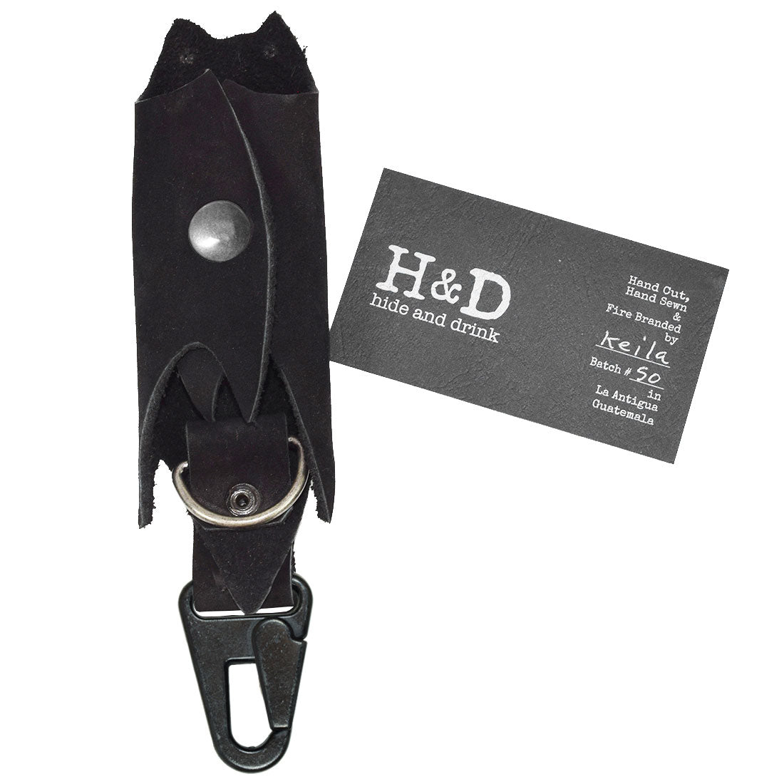 Bat-shaped Critter Key Chain by Hide & Drink, displayed mounted on a belt for practicality. This stylish Animal Key Ring Holder is made from quality Full Grain Leather, perfect for anyone looking to keep their keys organized with flair. Handmade in La Antigua Guatemala & Oaxaca Mexico.