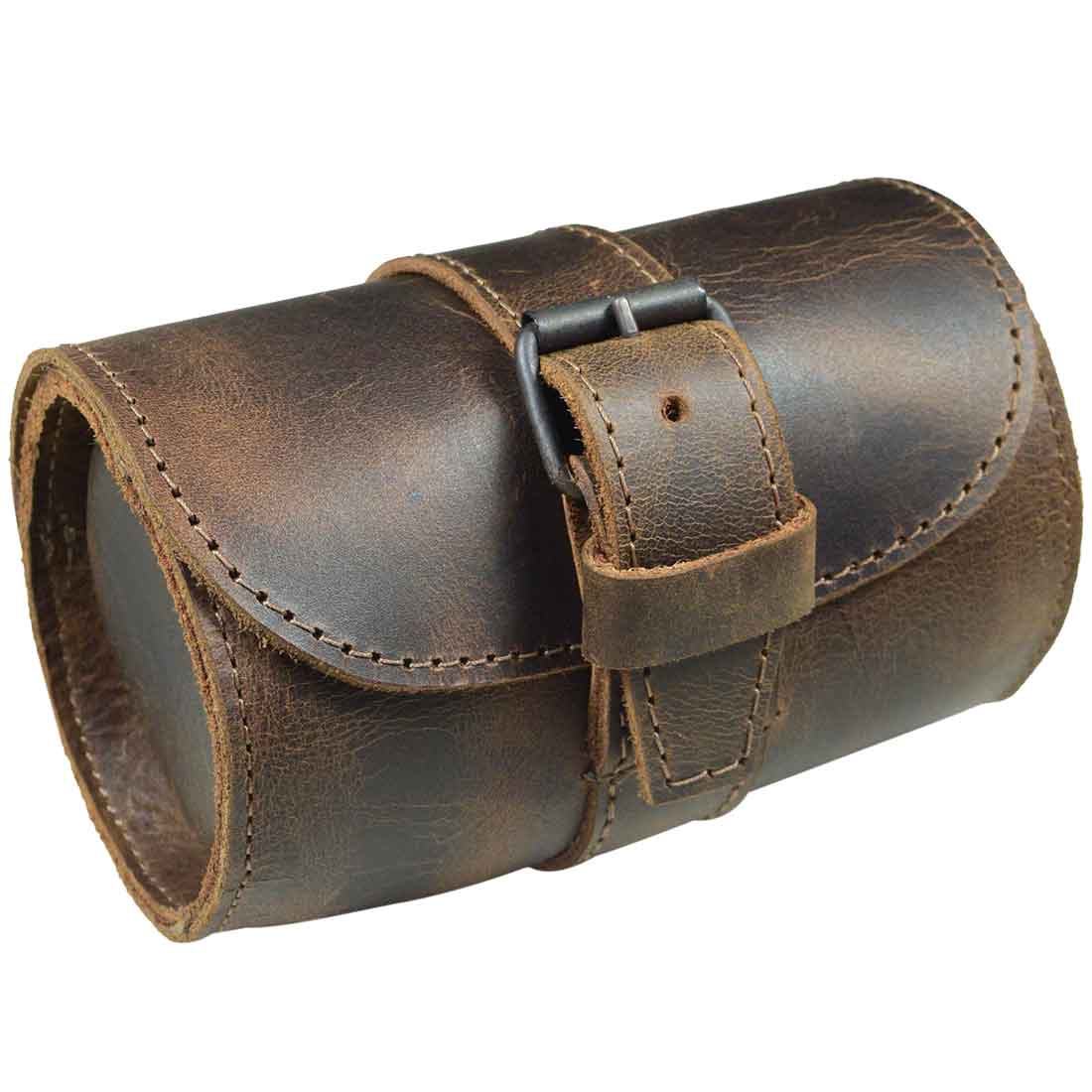 Side view of the Hide & Drink Single Watch Case, elegantly secured. This Cylinder Watch Case with Cushion offers thoughtful jewelry organization and travel convenience, designed with durable Full Grain Leather. Artisan-made in La Antigua Guatemala & Oaxaca Mexico, demonstrating the integrity of hand cut and hand sewn craftsmanship.
