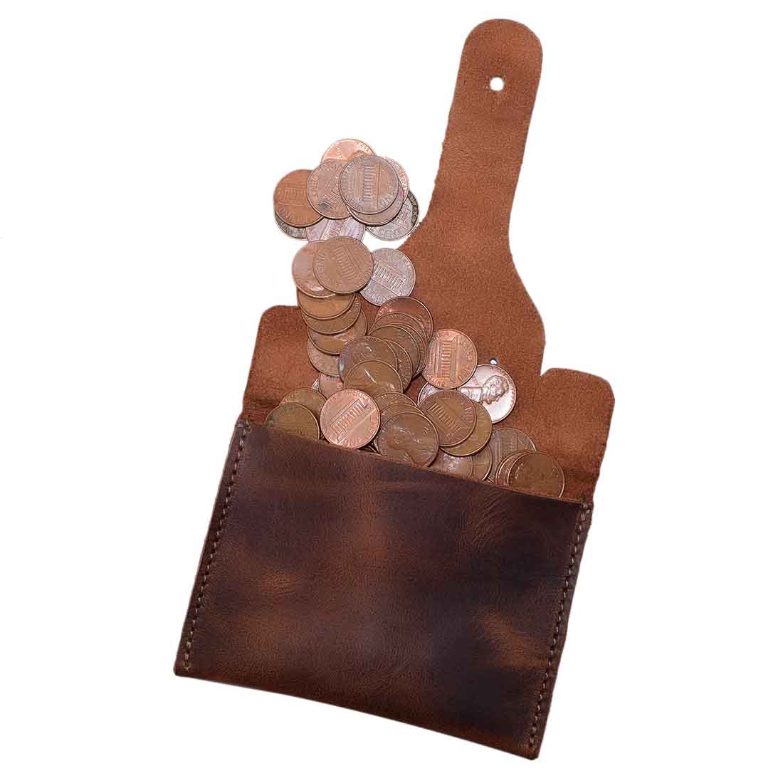 Elephant Coin Pouch by Hide & Drink overflowing with coins, crafted from high-quality full grain leather, perfect for everyday use as a wallet or storage solution. Card Pouch Elephant/Coin & Folded Bills/Wallet/Cable Holder/USB/SD/Change, Full Grain Leather, StockyardX, Hand Cut, Hand Sewn, Fire Branded, Artisan, Handmade in La Antigua Guatemala & Oaxaca Mexico.