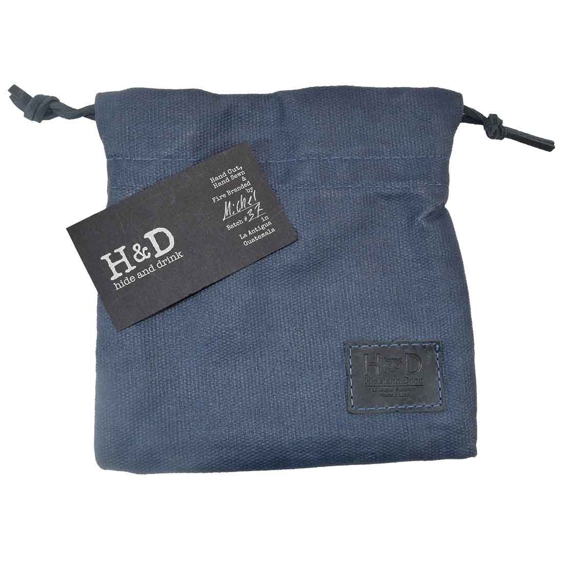 Hide & Drink Golf Pouch in sleek black color, perfect for organizational purposes during outings. Made from durable waxed canvas, it's a must-have for golfers and collectors alike. Waxed Canvas Golf Valuables Field Pouch, Golf Bag, Sport Organizer, Multipurpose Pouch with String, StockyardX, Small Batch Production, Hand Cut, Hand Sewn, Fire Branded, Artisan, Handmade in La Antigua Guatemala & Oaxaca Mexico.