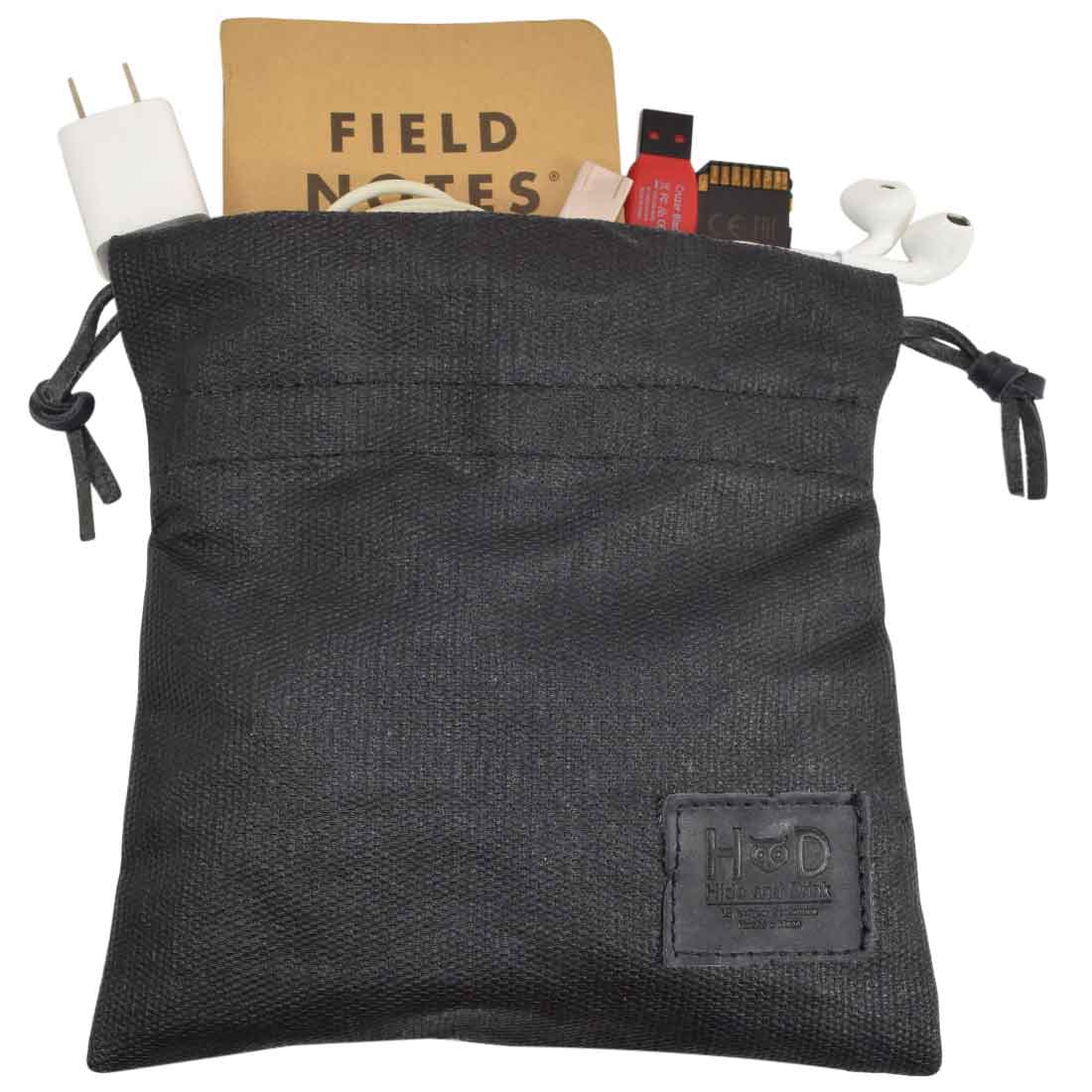 Hide & Drink Golf Pouch displaying its sleek black finish, showing off its capacity for keeping items organized. This waxed canvas pouch is perfect for storing golf essentials and more. Waxed Canvas Golf Valuables Field Pouch, Golf Bag, Sport Organizer, Multipurpose Pouch with String, StockyardX, Small Batch Production, Hand Cut, Hand Sewn, Fire Branded, Artisan, Handmade in La Antigua Guatemala & Oaxaca Mexico.