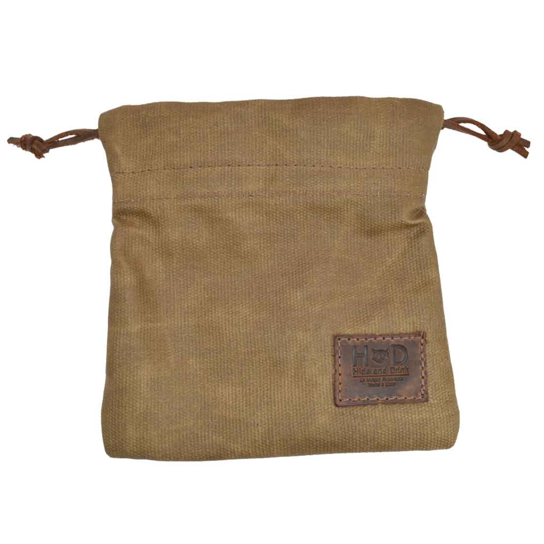 Hide & Drink Golf Pouch in light brown, perfect for securing small items. This handcrafted waxed canvas pouch adds elegance and practicality to your golf bag essentials. Waxed Canvas Golf Valuables Field Pouch, Golf Bag, Sport Organizer, Multipurpose Pouch with String, StockyardX, Small Batch Production, Hand Cut, Hand Sewn, Fire Branded, Artisan, Handmade in La Antigua Guatemala & Oaxaca Mexico.