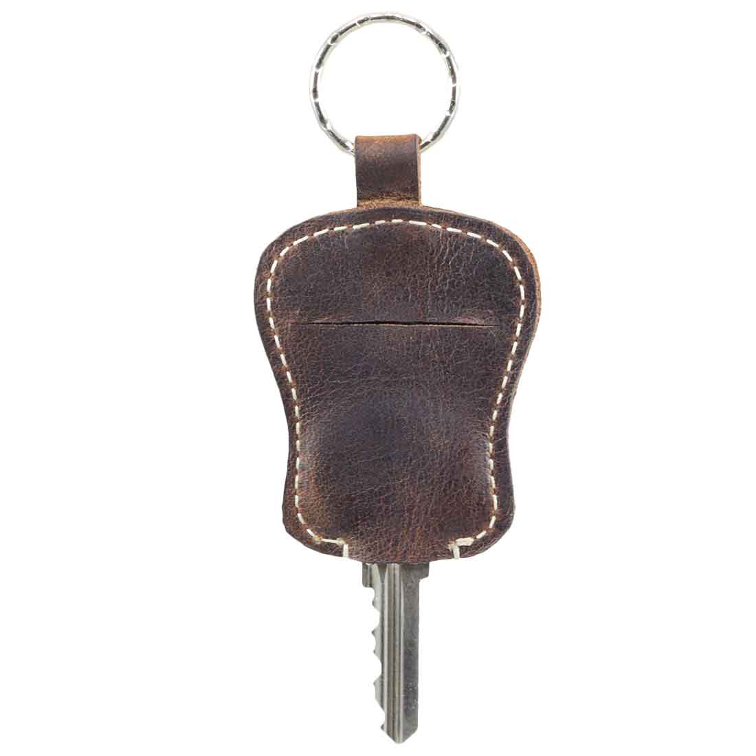 Another angle of the Guitar Keychain by Hide & Drink, highlighting its detailed workmanship. This keyring with pouch for your go-to key demonstrates the quality of handmade goods crafted from Full Grain Leather in a small batch production setting, from artisan workshops in La Antigua Guatemala & Oaxaca Mexico.